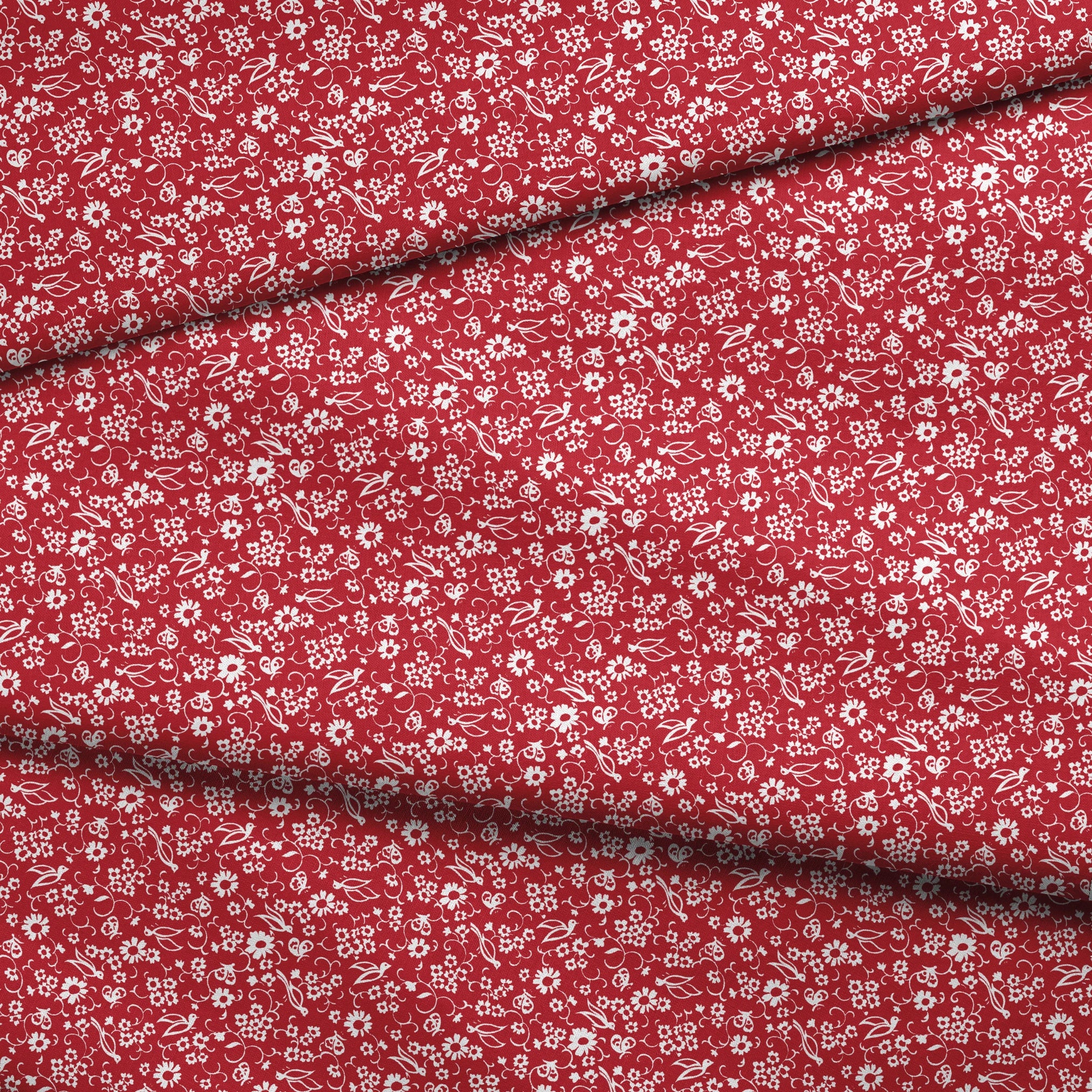 White floral and bird silhouette pattern on a bright red background. fabric fold mockup