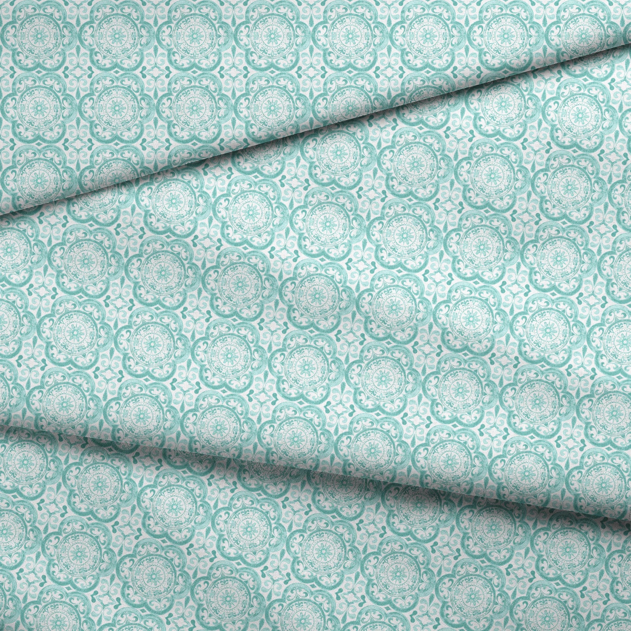 Teal medallion tile-inspired design with intricate floral and scroll details by Nicole Tamarin, from the Squeeze the Day collection. fabric fold mockup