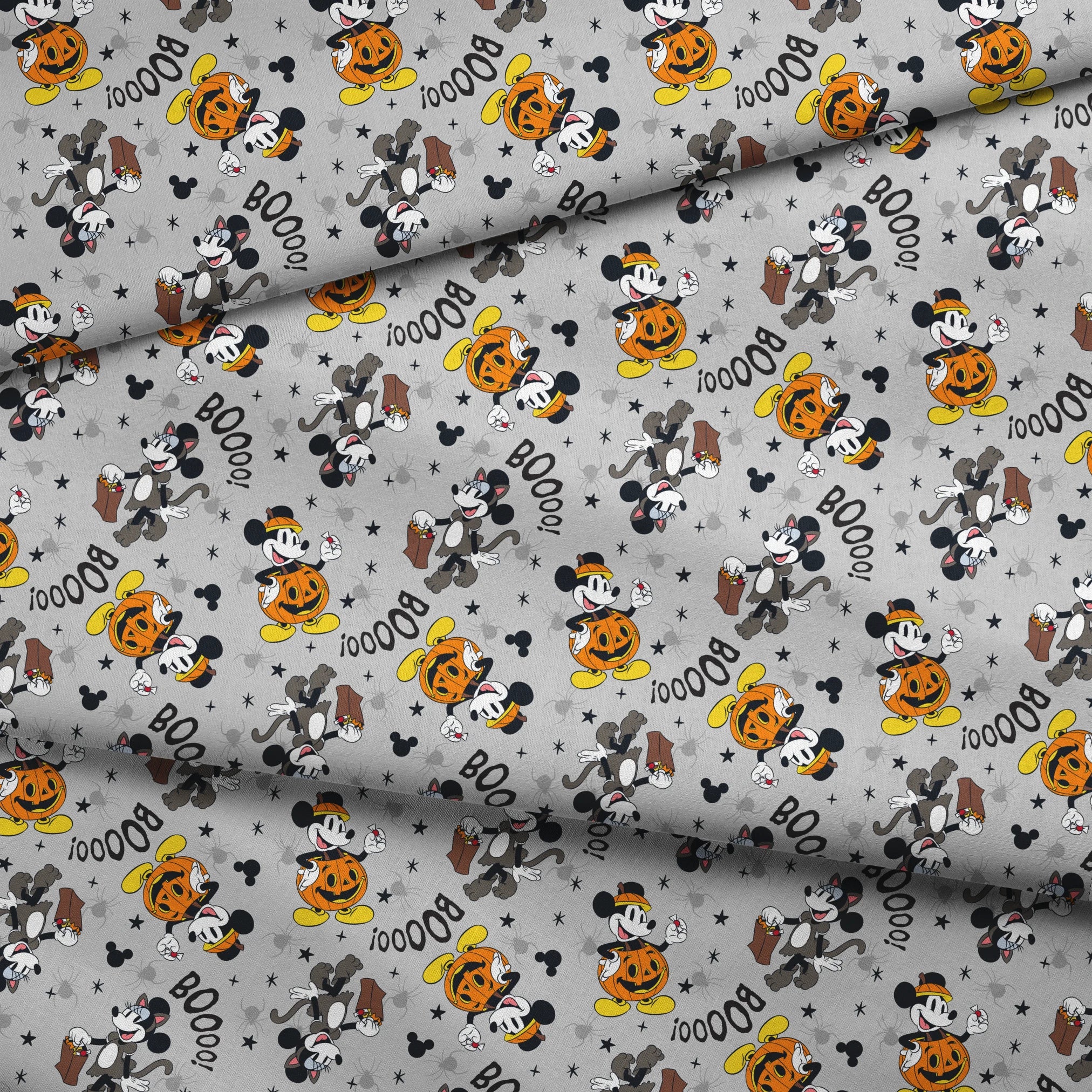 Mickey Mouse Halloween pattern with pumpkins, spiders, bats, "BOO!" text on gray background fabric fold mockup