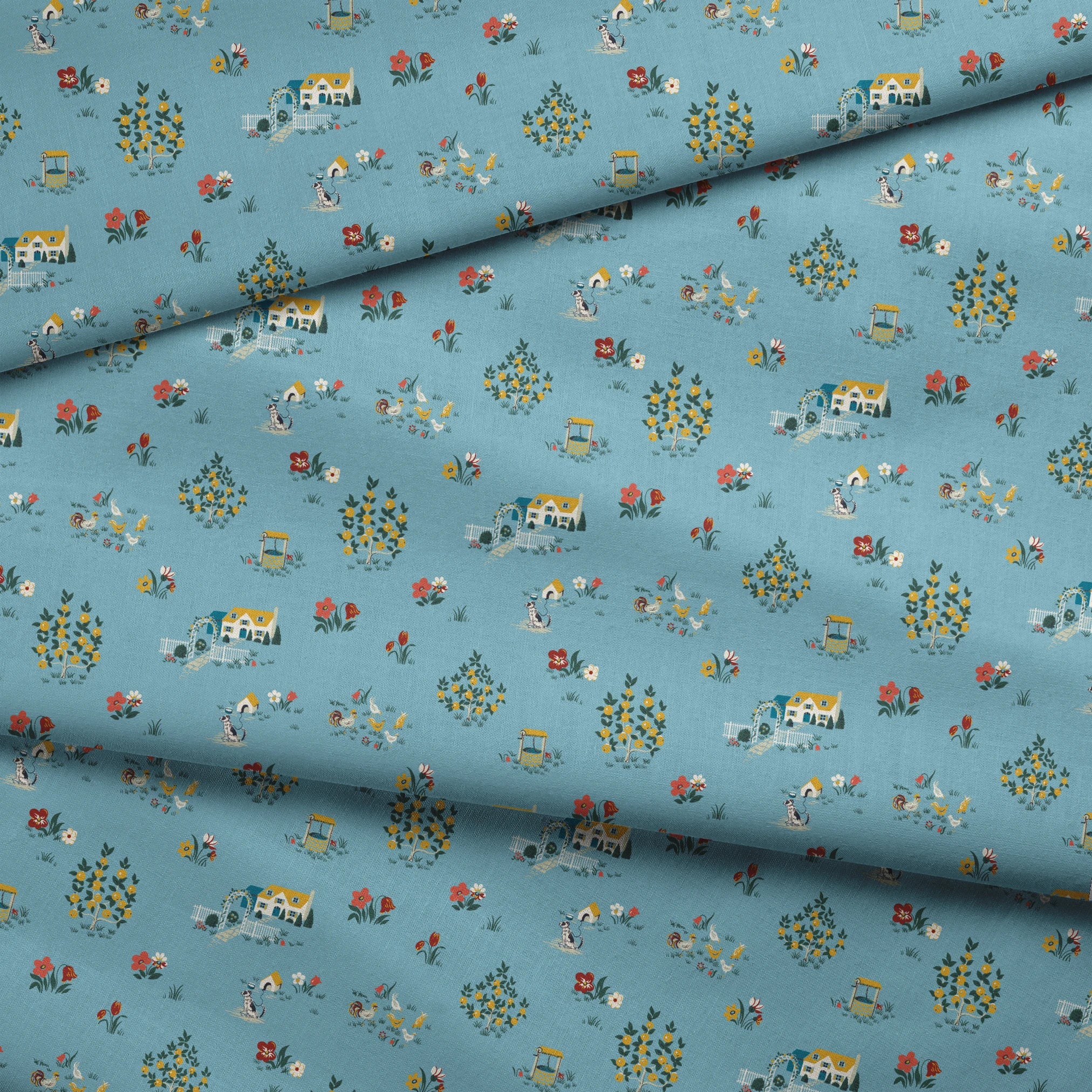 Blue-gray background with repeating folk art pattern of small cottages, white geese, floral clusters, and colorful tulips in yellow and red. fabric fold mockup
