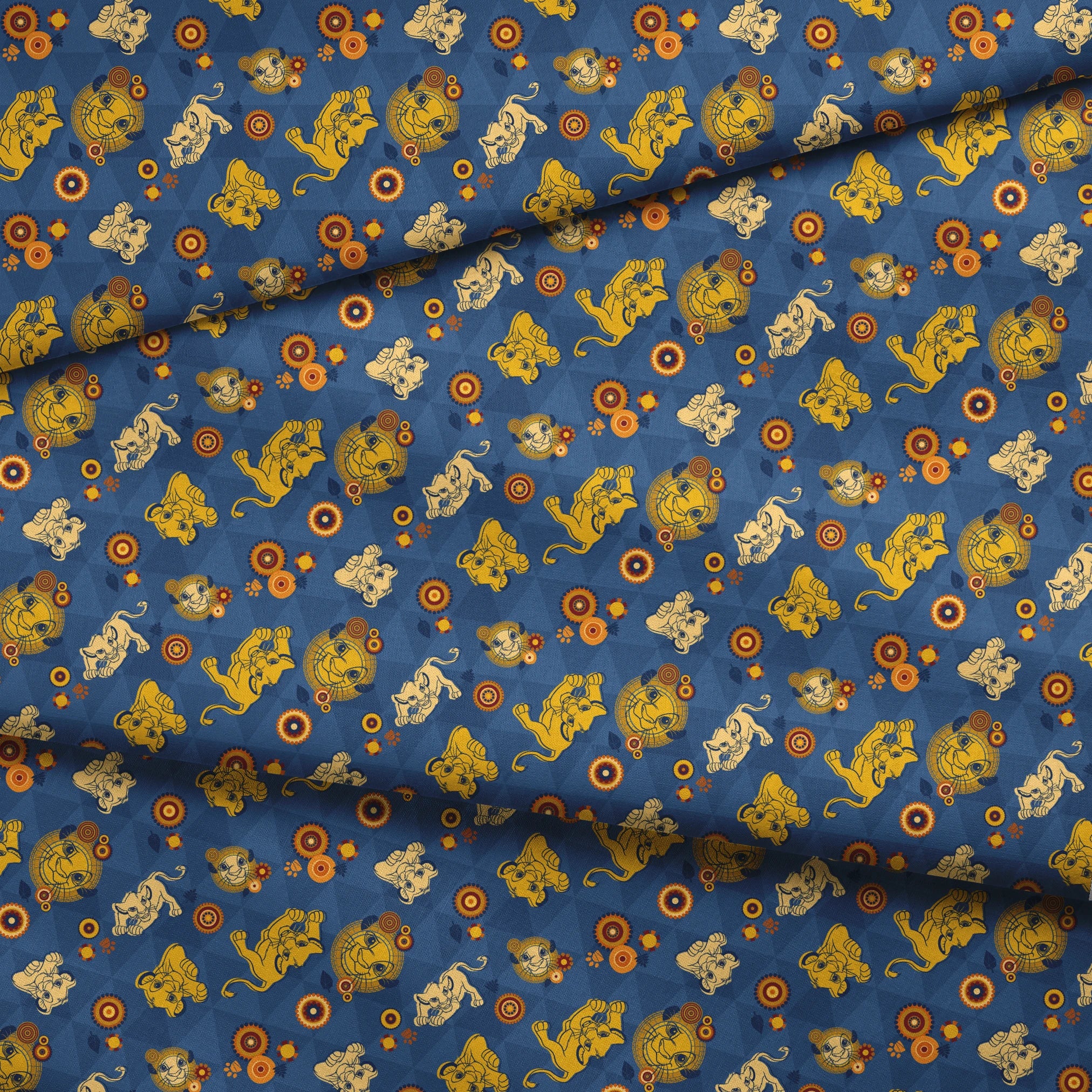 Geometric pattern with yellow lion figures and circular designs on blue triangular background fabric fold mockup