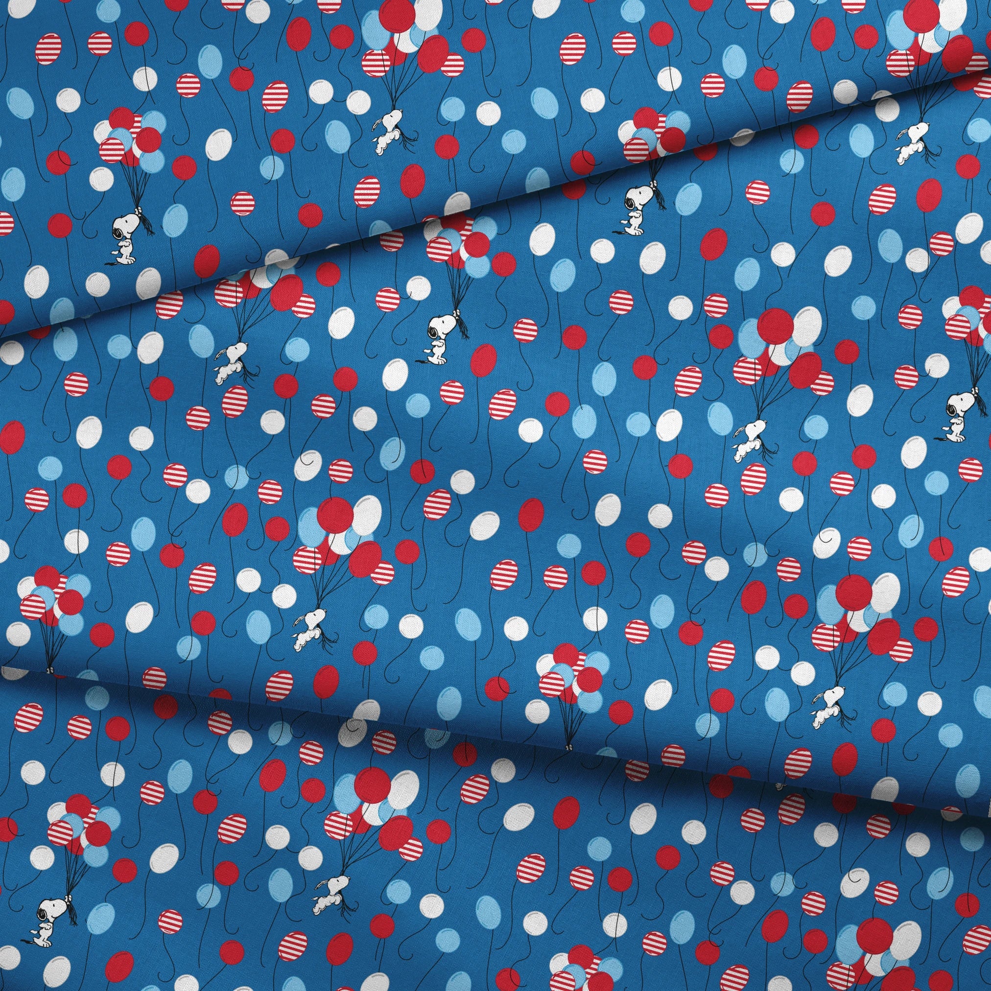 Snoopy patriotic blue pattern with red, white, and blue balloons and stars in American flag style fabric fold mockup