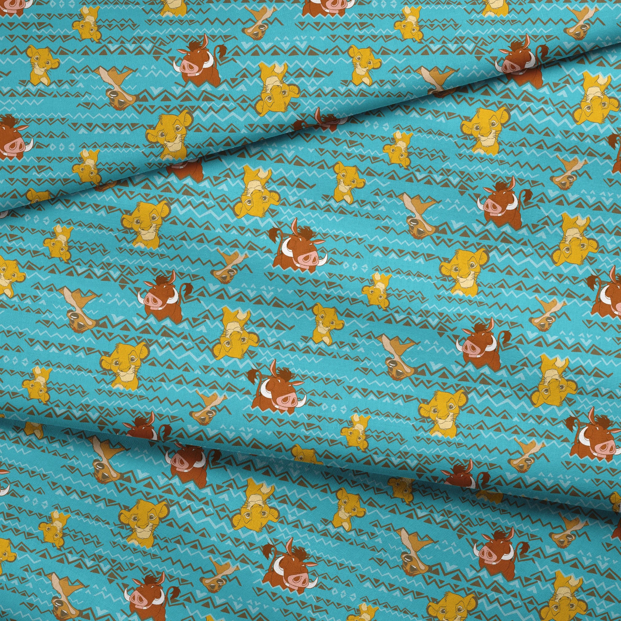 Lion King themed pattern with Simba and Timon characters on turquoise blue background with zigzag stripes fabric fold mockup