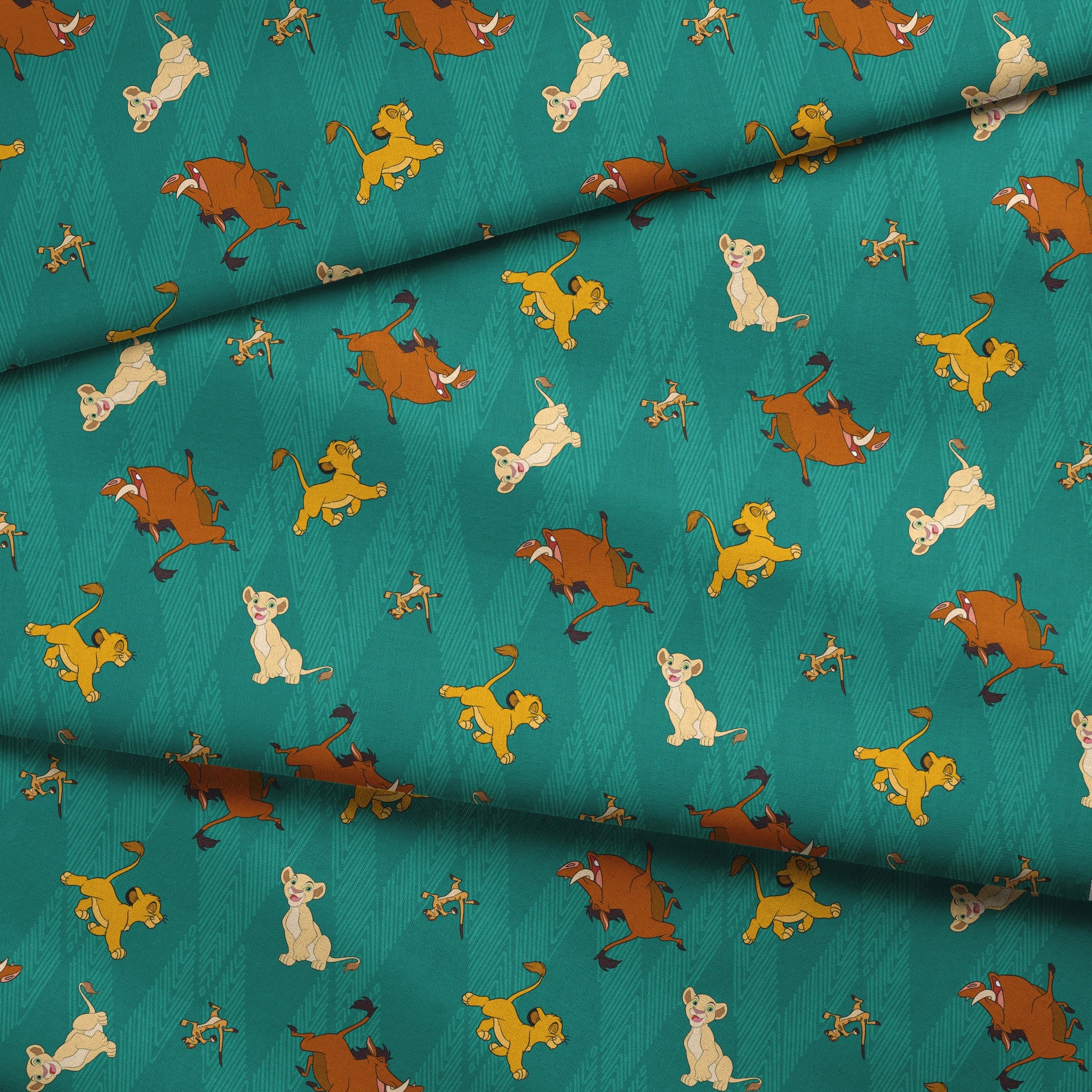 Lion cubs in various poses on teal zigzag background; yellow, cream, and brown lions jumping and sitting fabric fold mockup