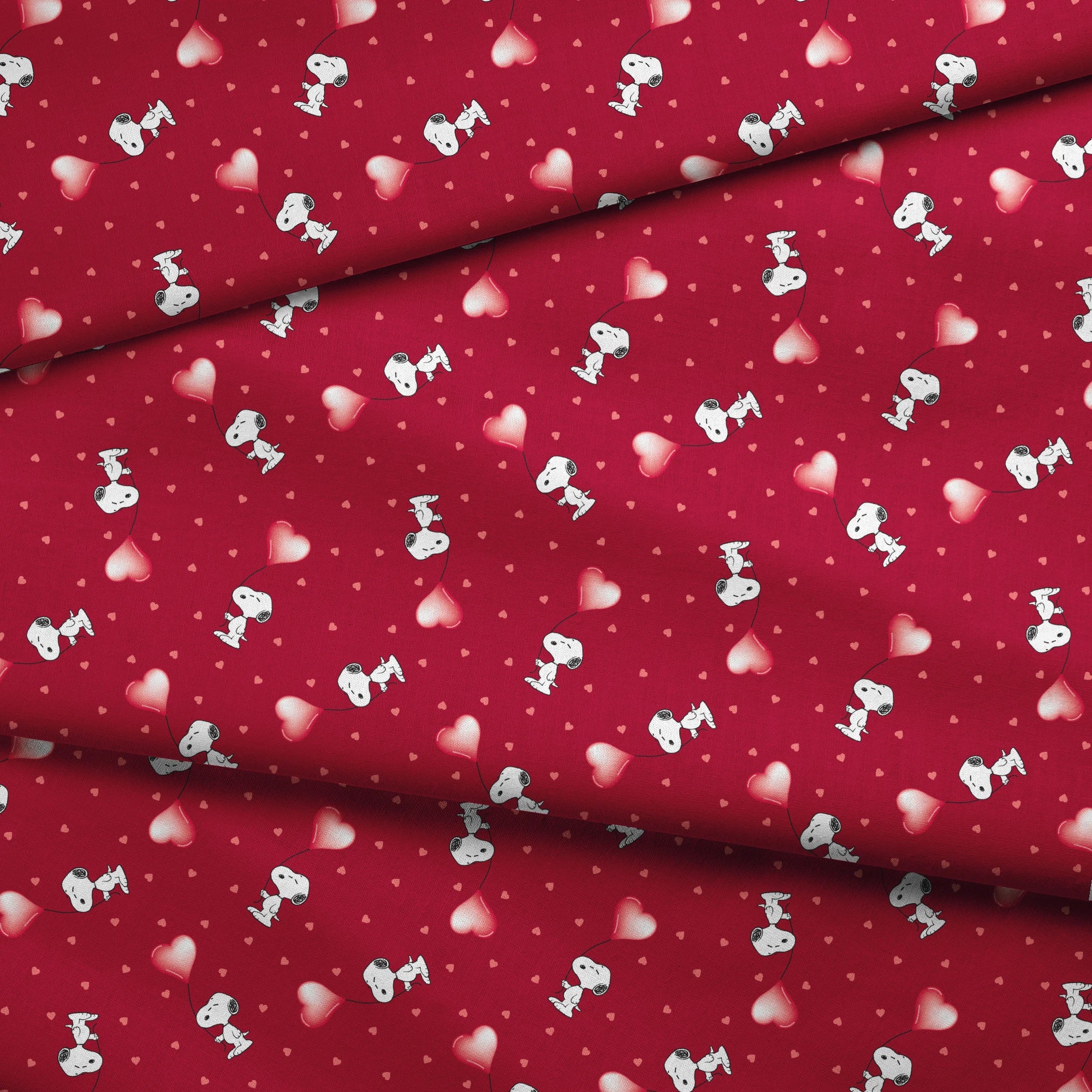 Snoopy scattered on red background with pink and white hearts pattern fabric fold mockup
