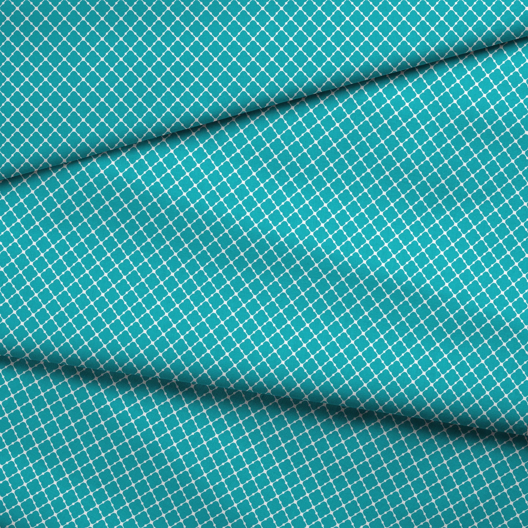 Turquoise and white quatrefoil pattern with Moroccan-inspired geometric design fabric fold mockup