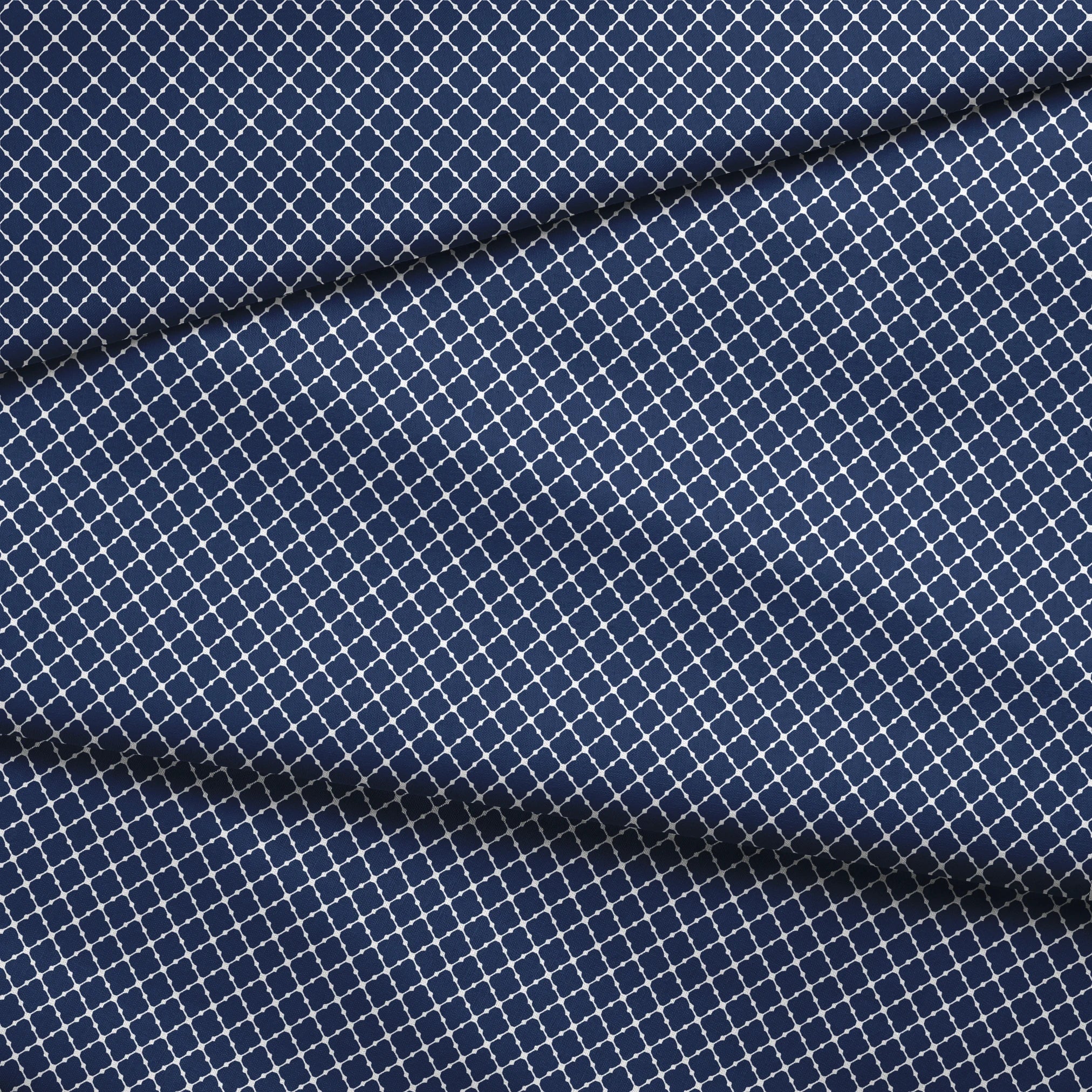 Navy blue quatrefoil pattern with white lattice design on dark background fabric fold mockup