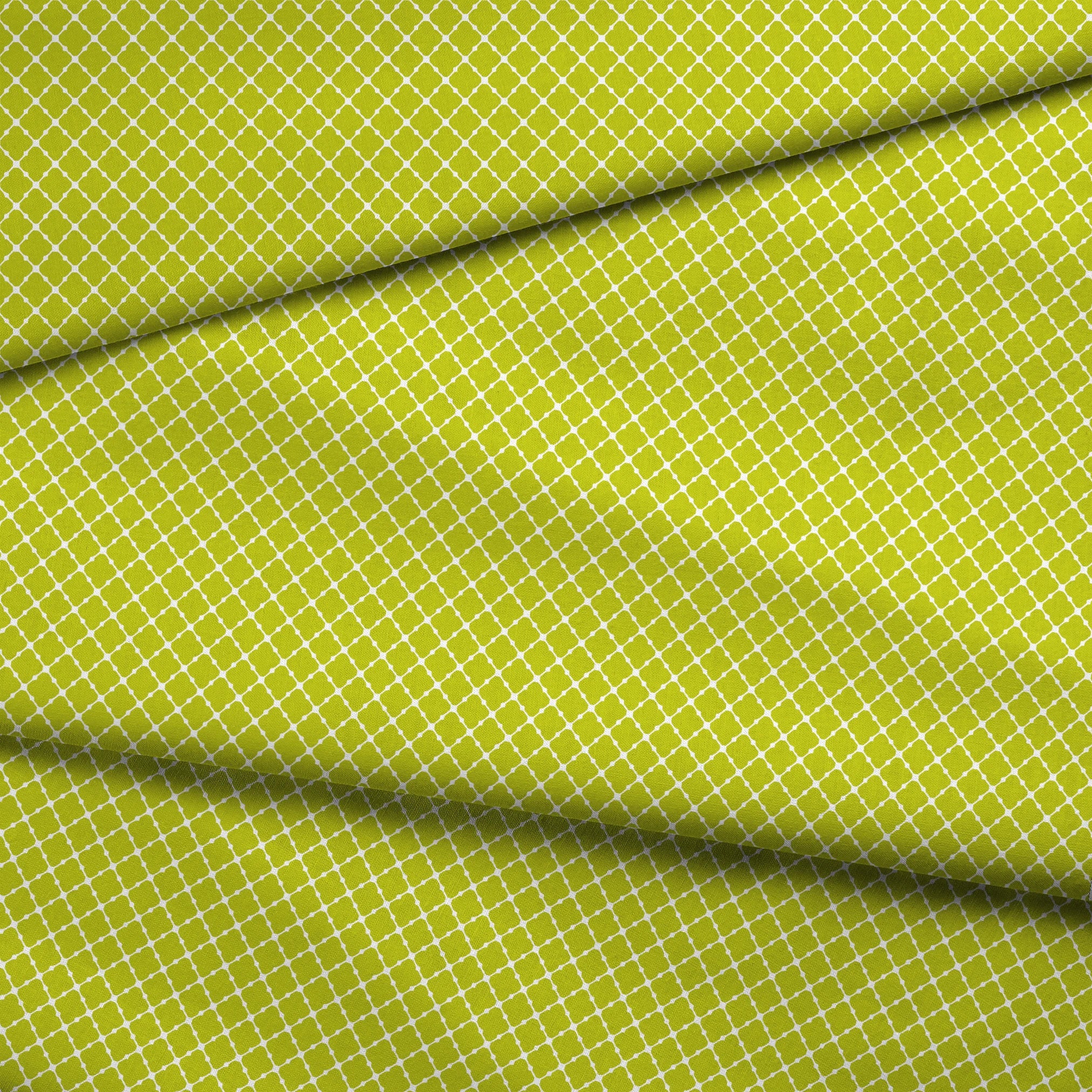 Chartreuse green quatrefoil pattern on white background, forming a geometric lattice design fabric fold mockup