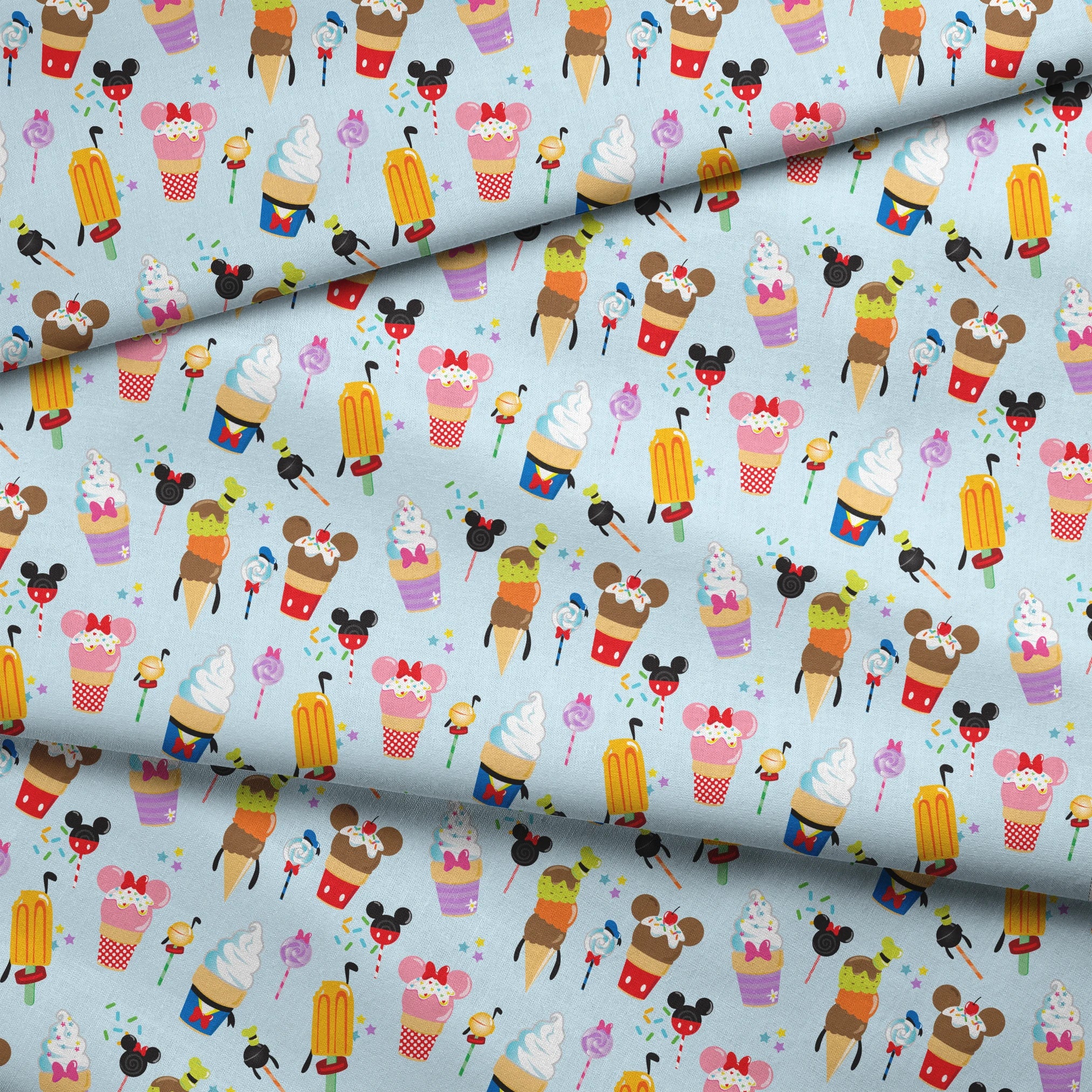 Disney-themed ice cream and sweet treats pattern with Mickey and Minnie icons on light blue background fabric fold mockup