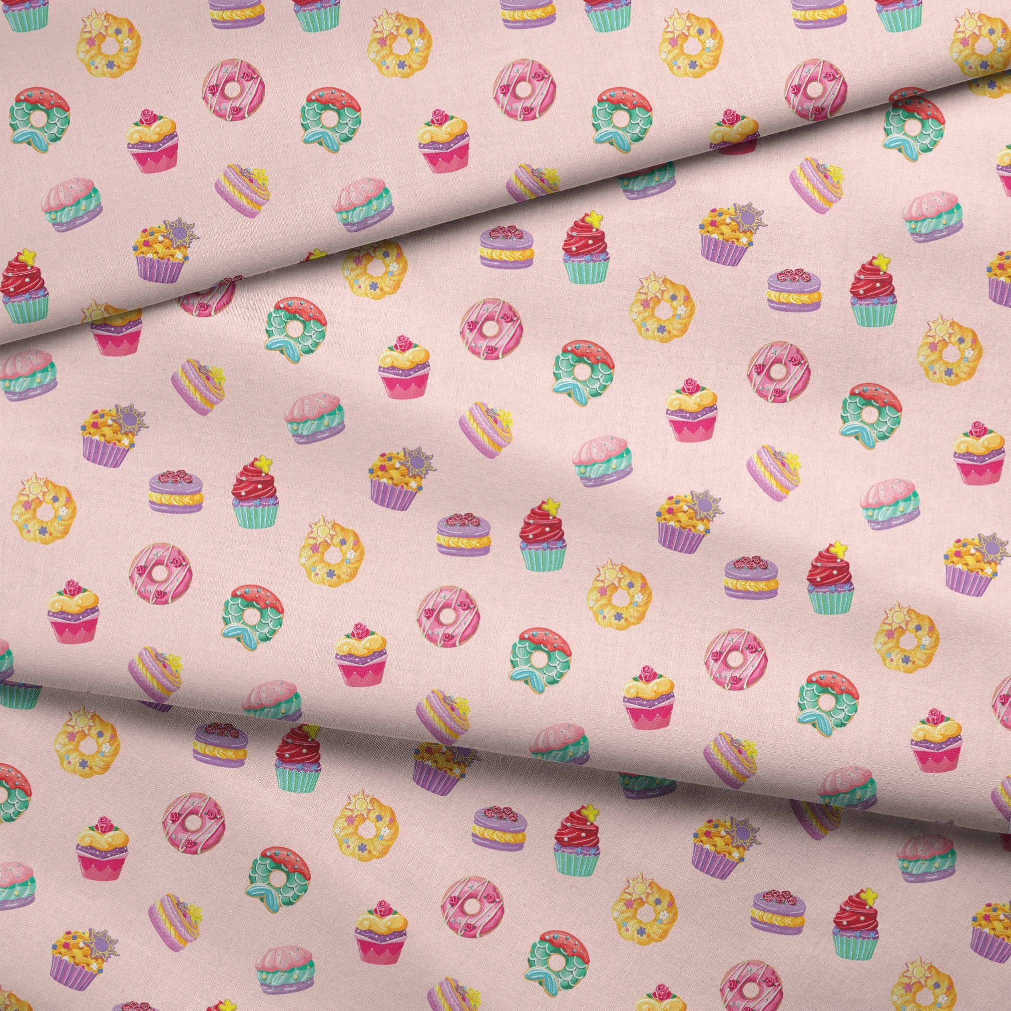 DIsney Princess-inspired dessert pattern with donuts, cupcakes, and macarons on a light pink background fabric fold mockup