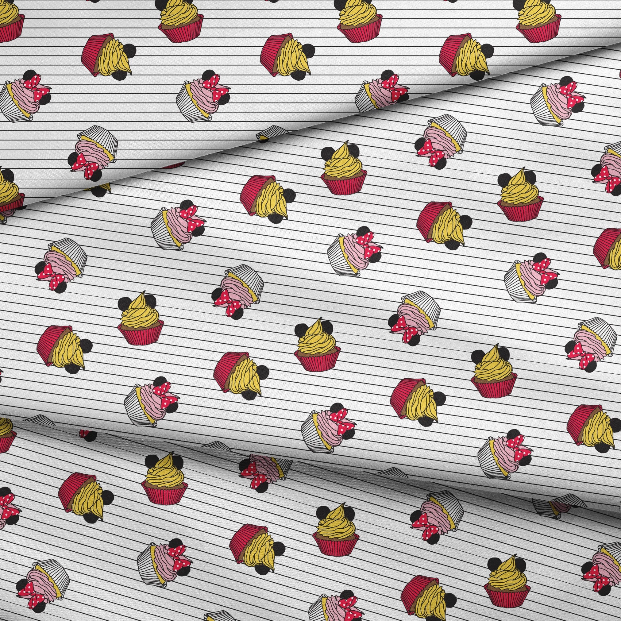 Colorful cartoon cupcakes with Mickey Mouse ears and bows scattered on striped background fabric fold mockup
