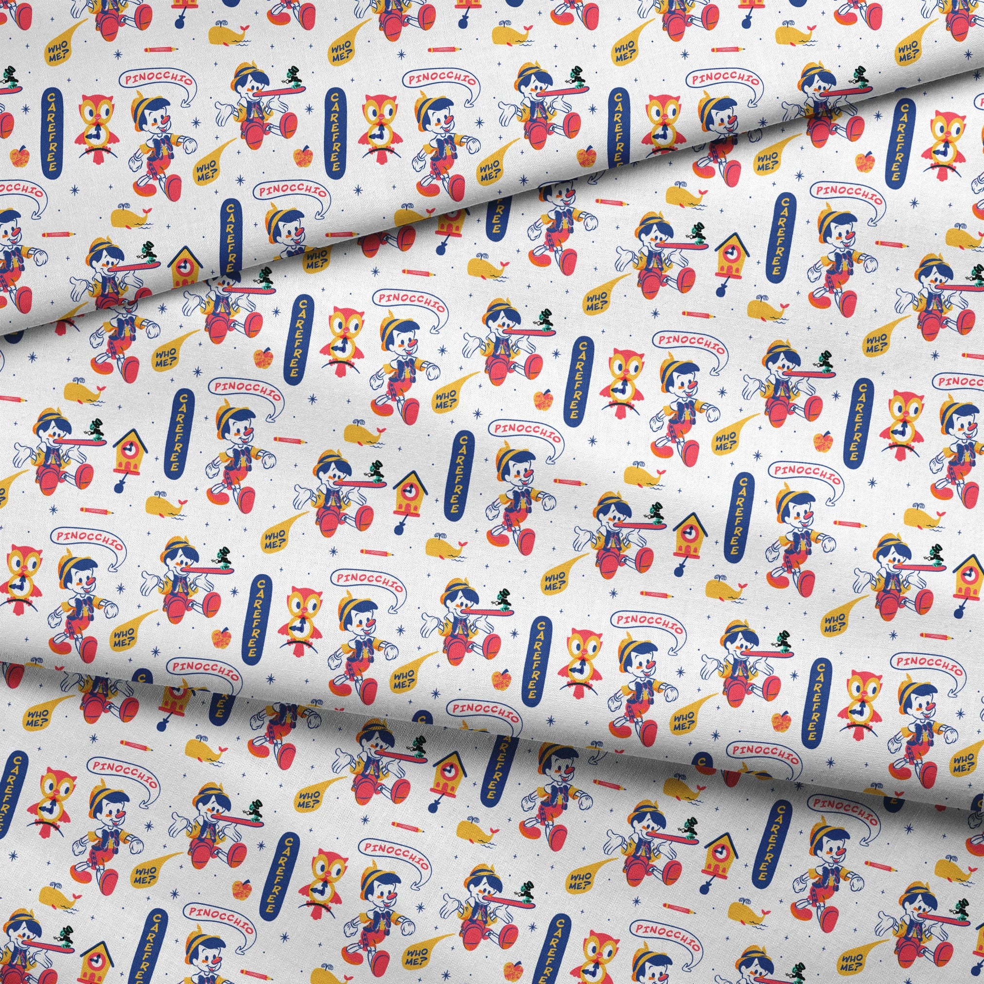 Colorful cartoon pattern featuring Pinocchio characters, whales, and text elements on white background fabric fold mockup