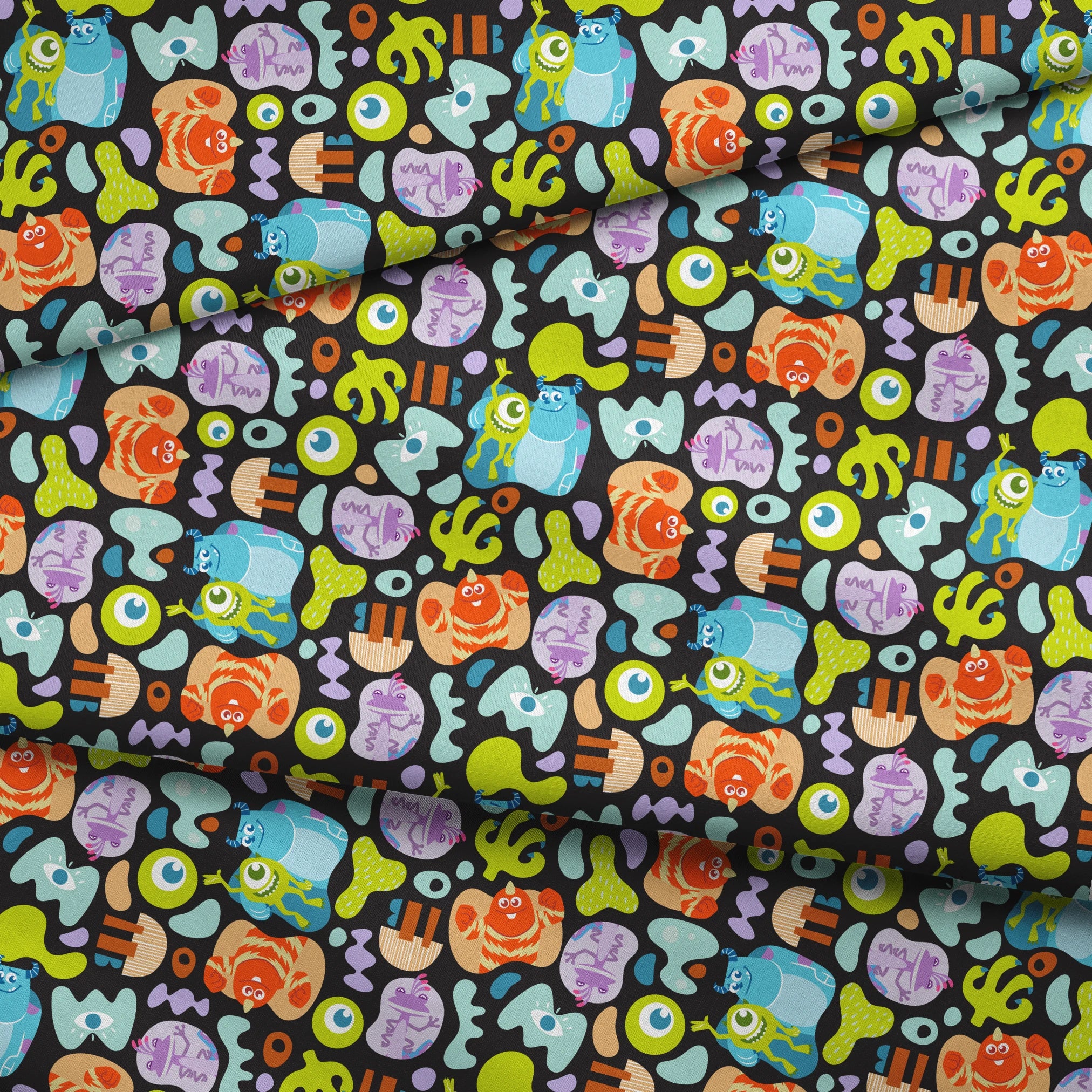 Colorful Monsters Inc pattern with Mike, Sulley and other characters on black background fabric fold mockup