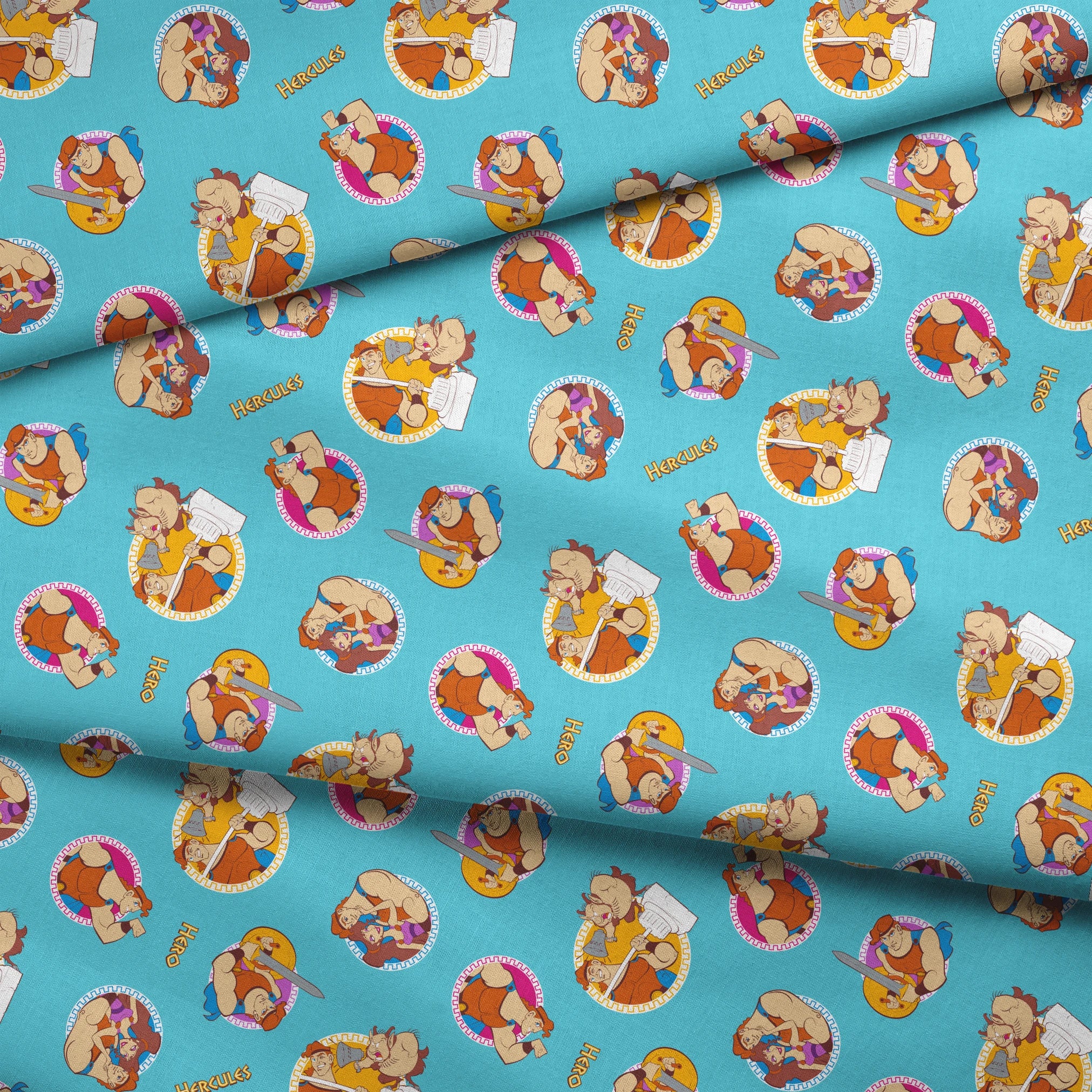 Cartoon characters from Hercules arranged in circular patterns on light blue background fabric fold mockup