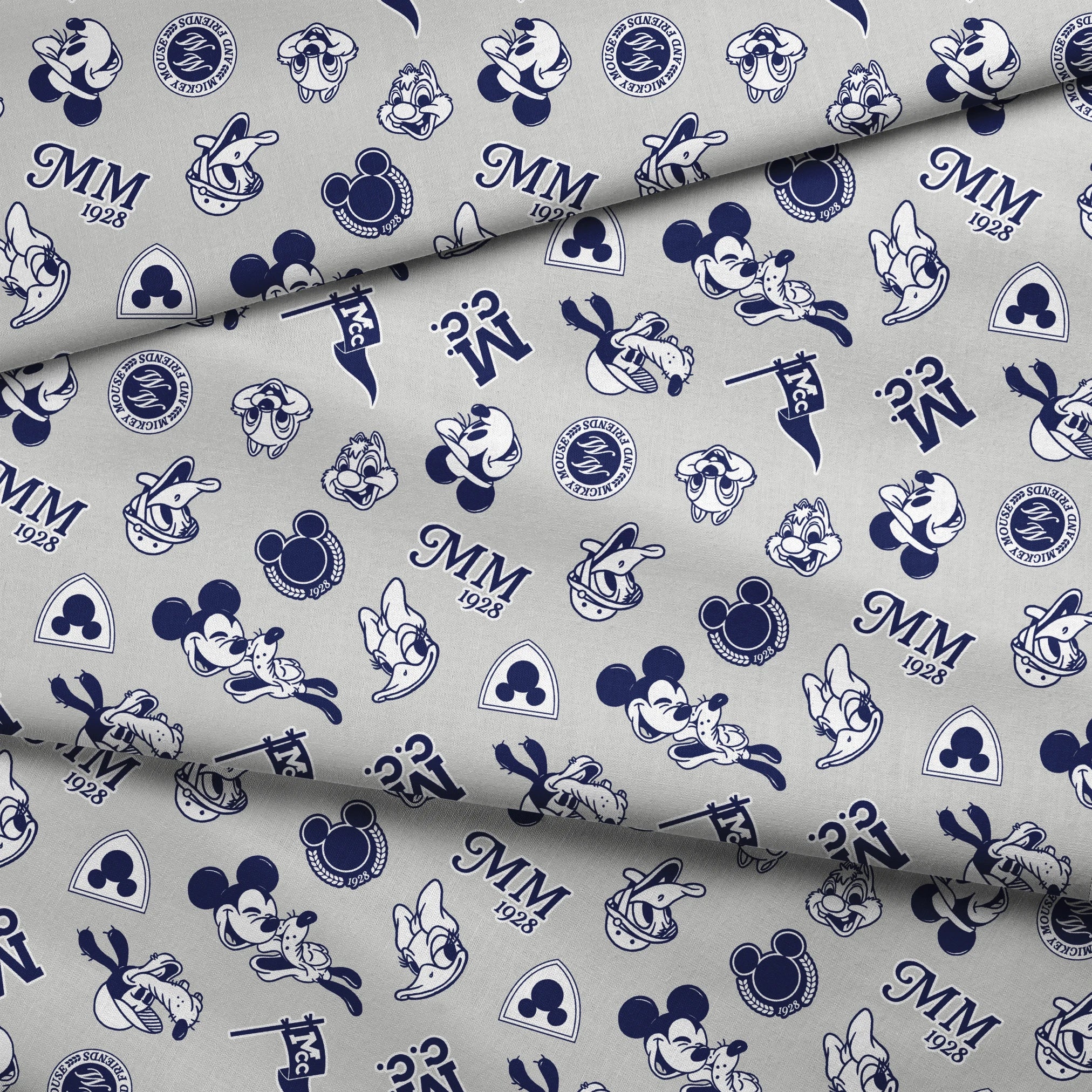Disney character pattern with Mickey Mouse, Donald Duck and other classic cartoon figures in navy blue on light background. fabric fold mockup