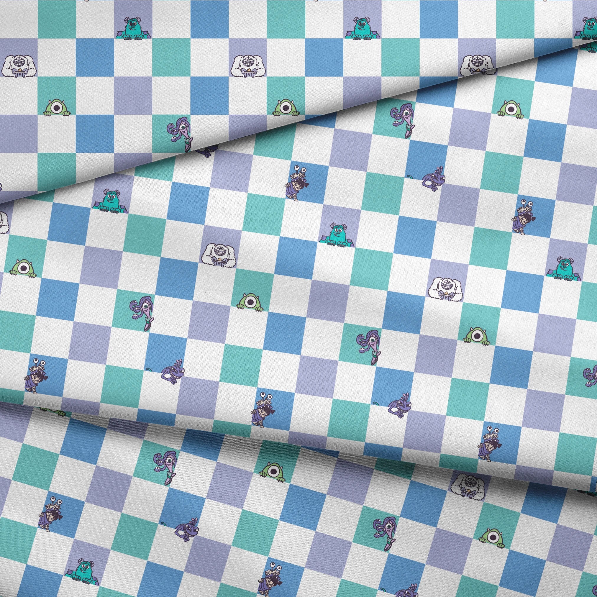 Monsters Inc characters on a checkered pattern of white, mint green, light purple, and blue squares fabric fold mockup