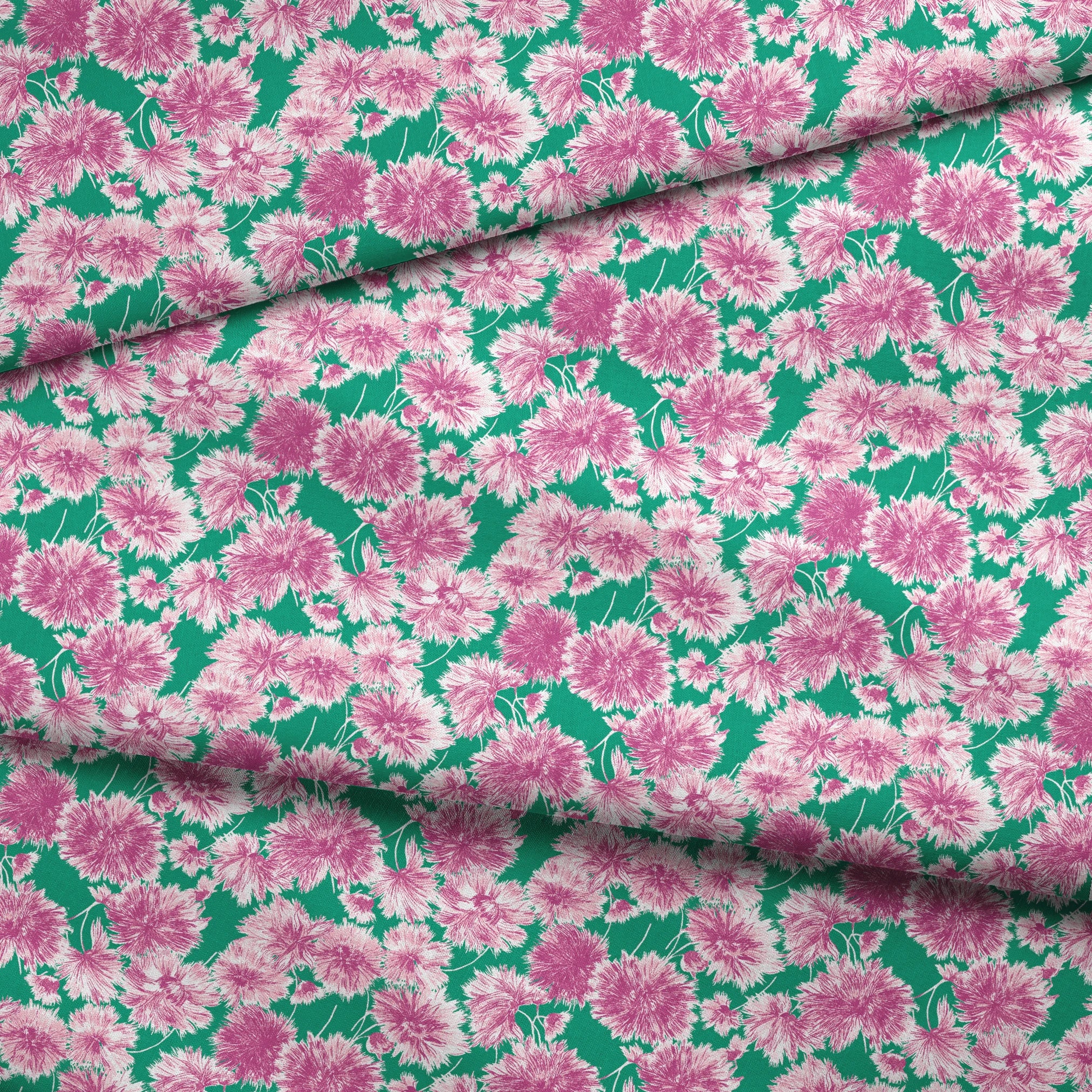 Pink and purple carnation flowers scattered on a green background in a repeating floral pattern fabric fold mockup