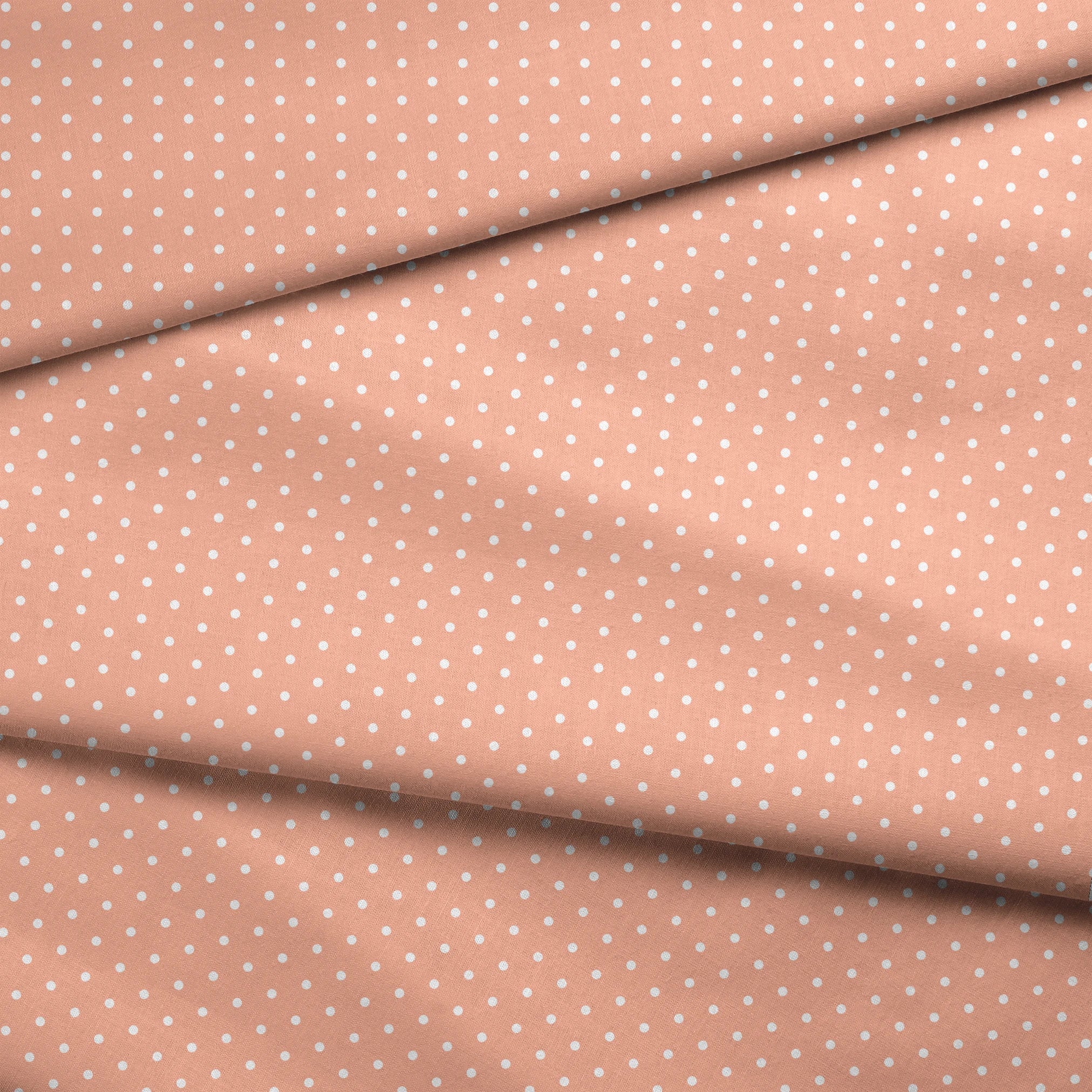 White circles on a peach/salmon colored background fabric fold mockup