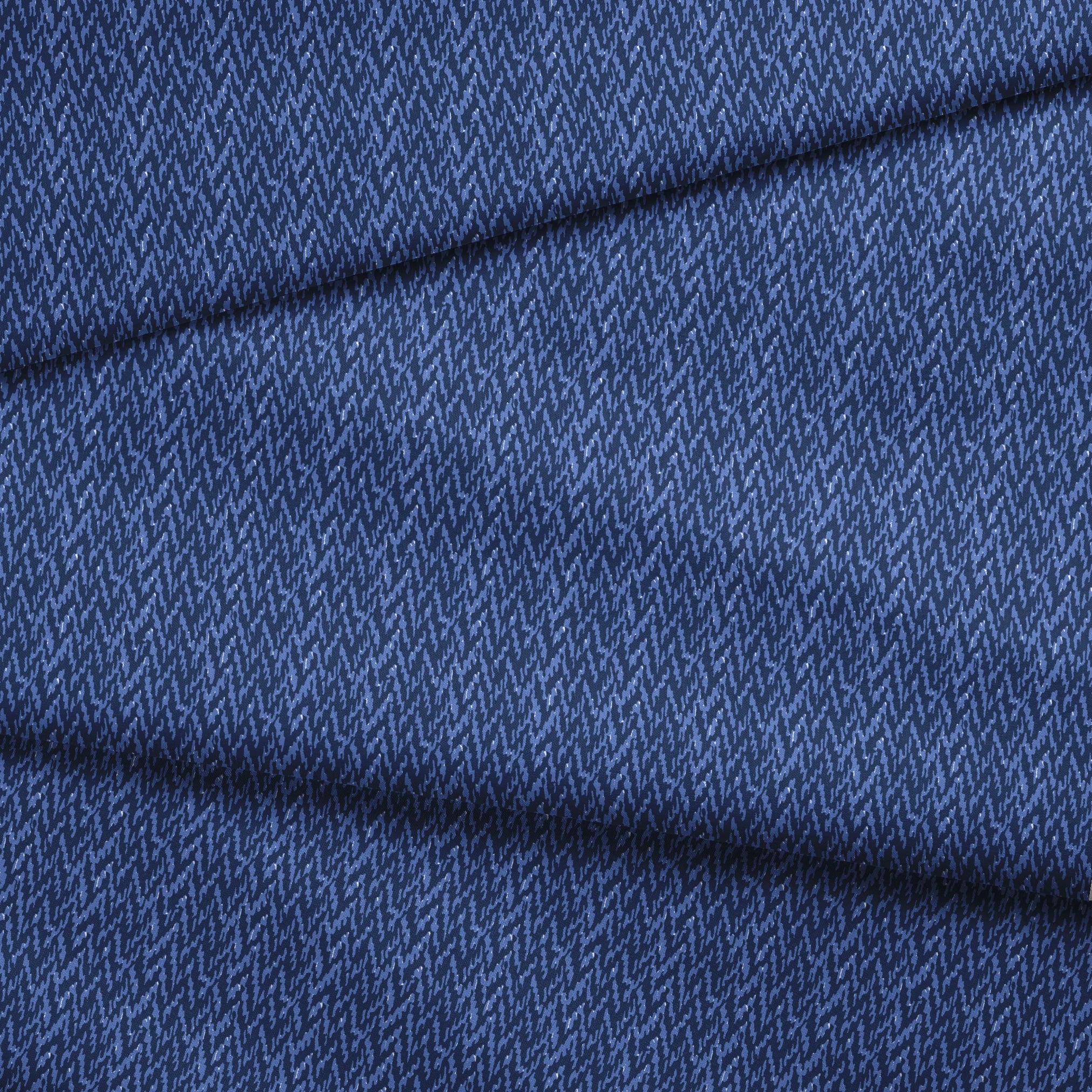 Abstract blue pattern with irregular vertical streaks in dark and light blue shades creating a textured, wavy appearance fabric fold mockup