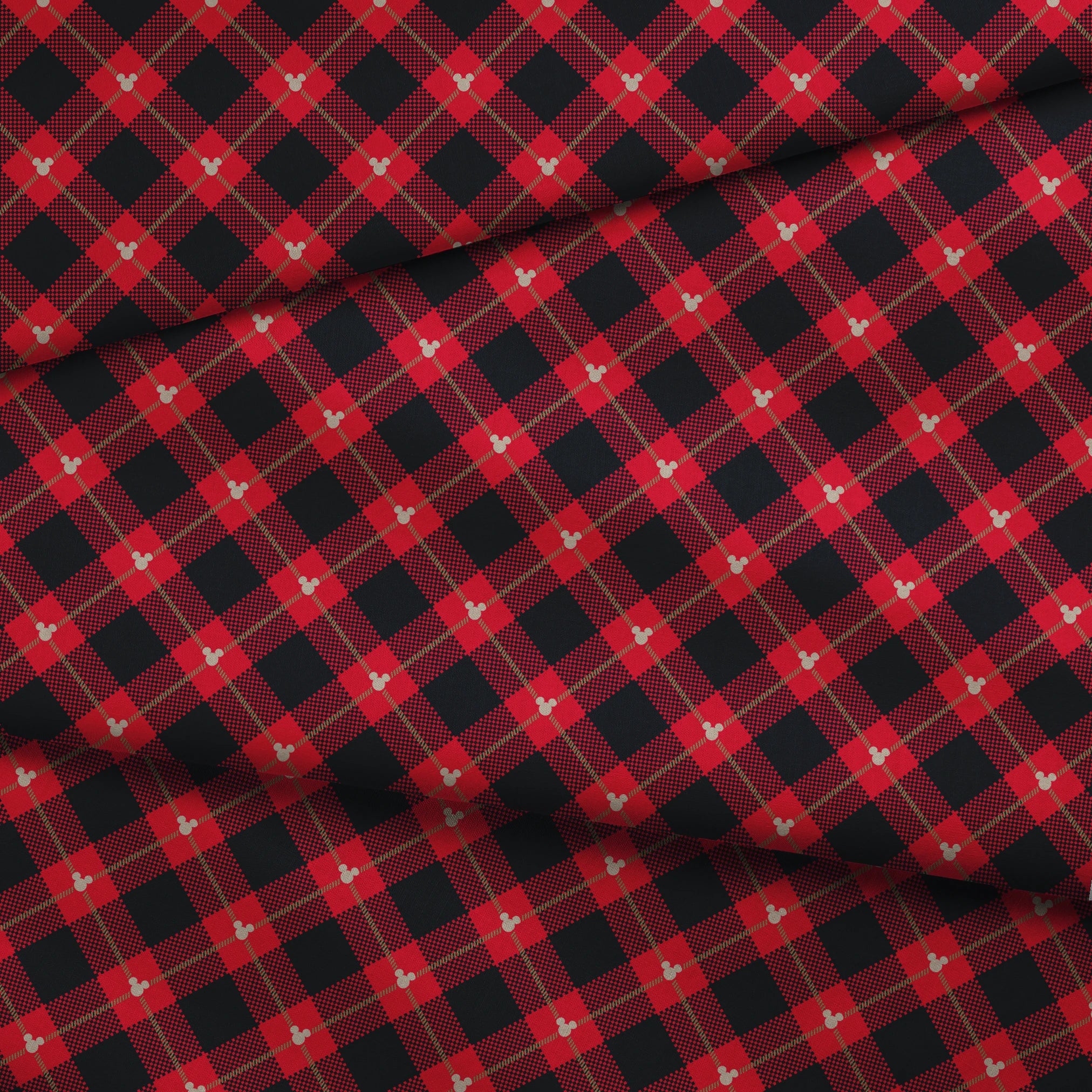 Red and black plaid pattern with diagonal gold stripes and small Mickey Mouse silhouettes fabric fold mockup