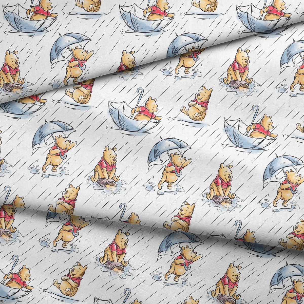 Small bear characters in a rainy scene - some holding umbrellas, others in paper boats, wearing red shirts fabric fold mockup