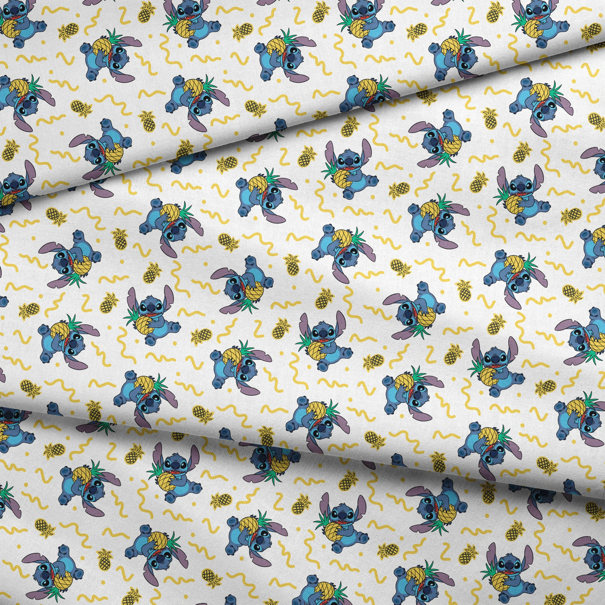 Disney's Stitch holding pineapples with yellow squiggly lines on white background pattern fabric fold mockup