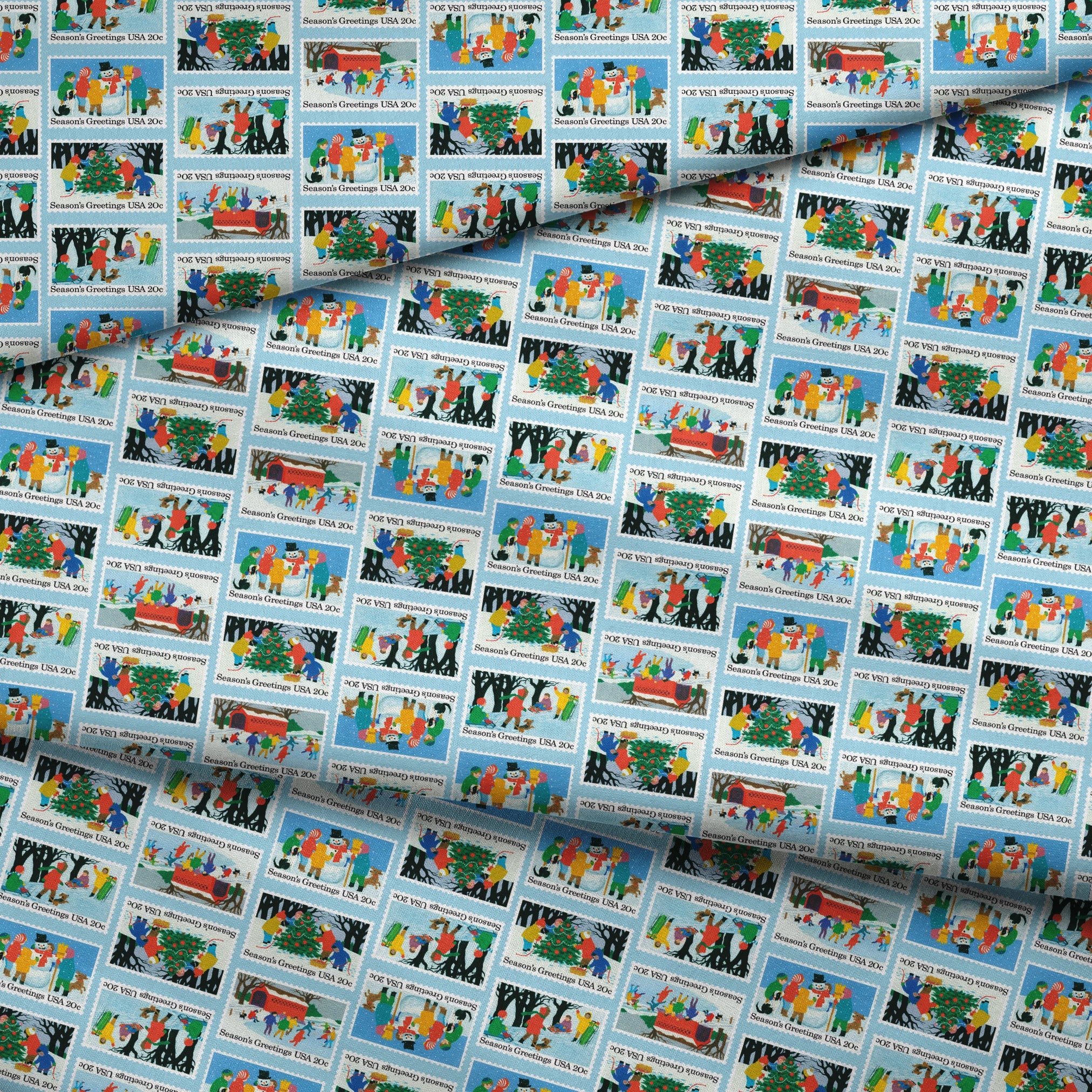 USPS Scenic Season's Greetings Stamps on Blue Fabric