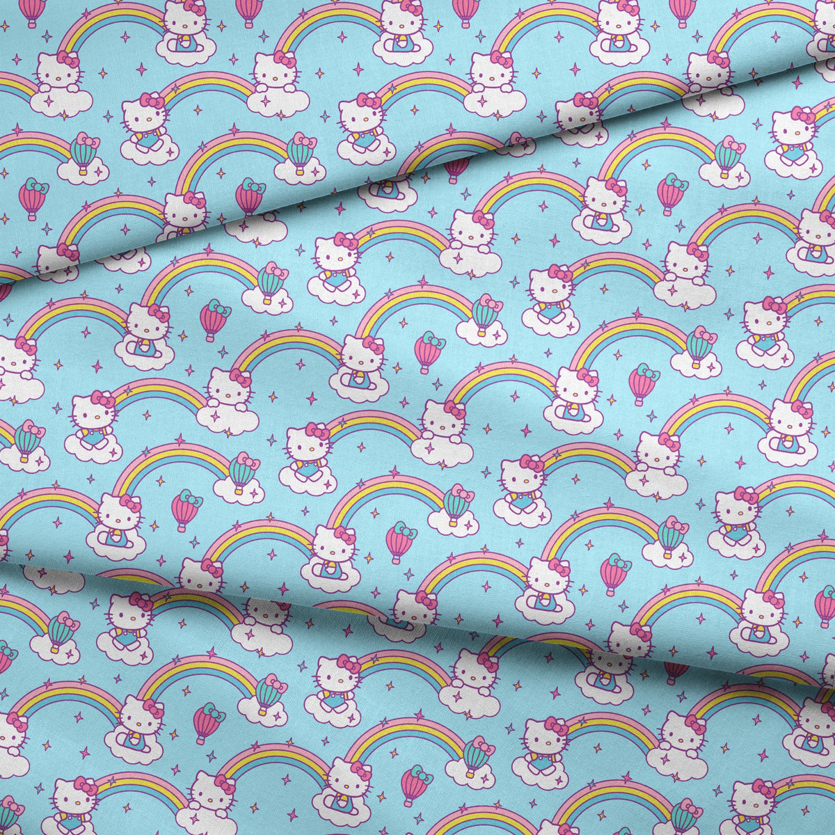 Hello Kitty® Rainbows & Clouds on Blue Fabric