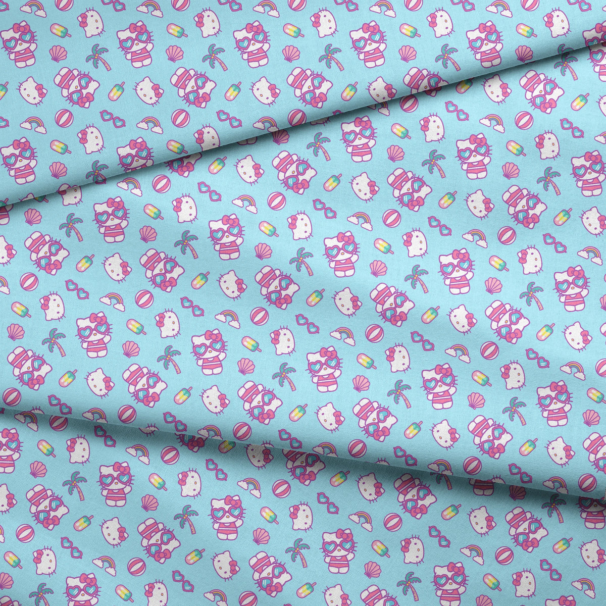 Hello Kitty® Beach Day Fun on Blue Fabric