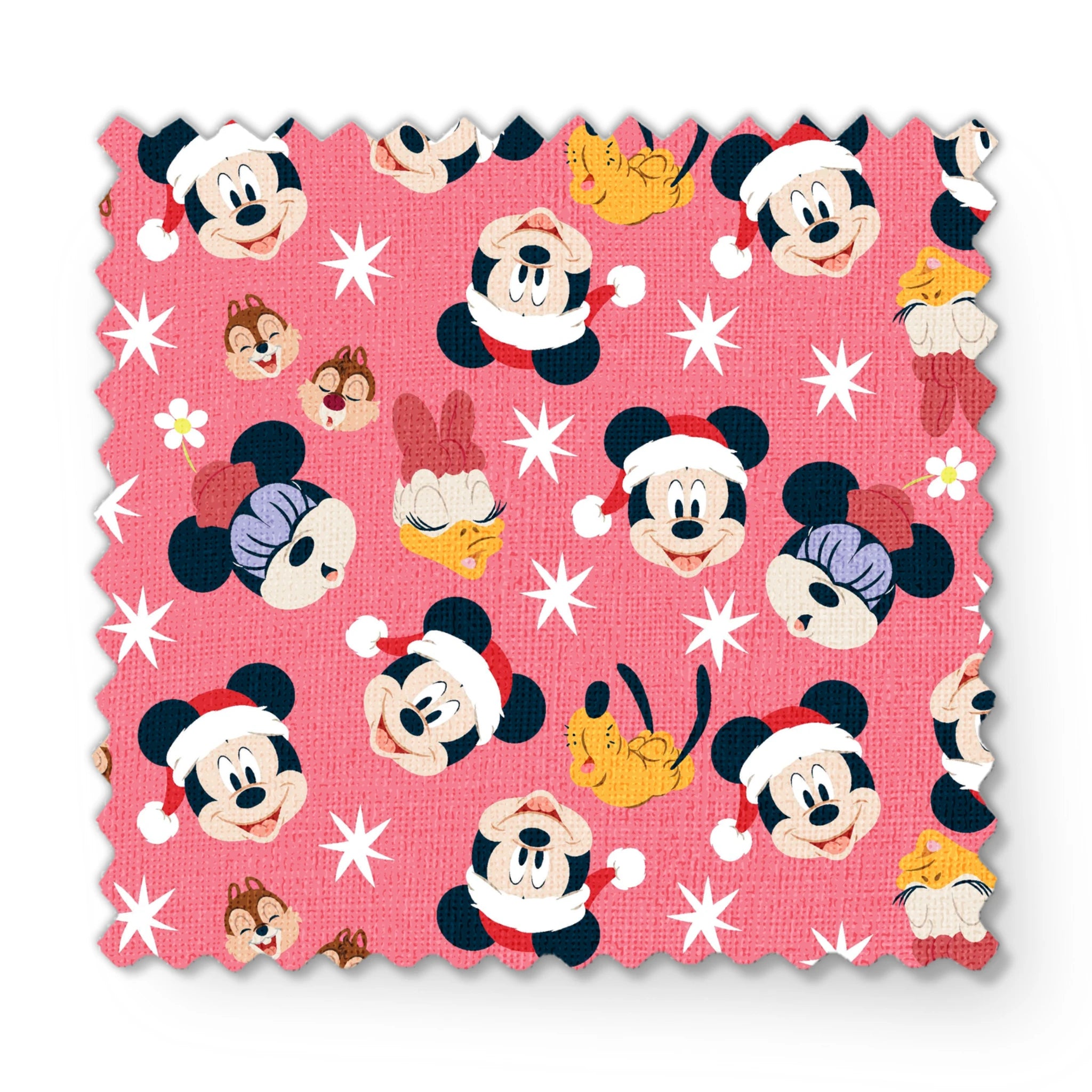 Mickey Mouse pattern with holiday elements on pink background, featuring white stars and gold accents fabric swatch mockup