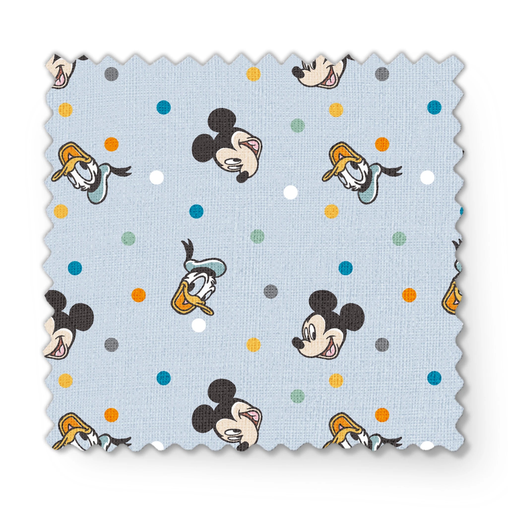 Disney character pattern with Mickey Mouse and Donald Duck heads scattered on light blue background with colorful polka dots fabric swatch mockup