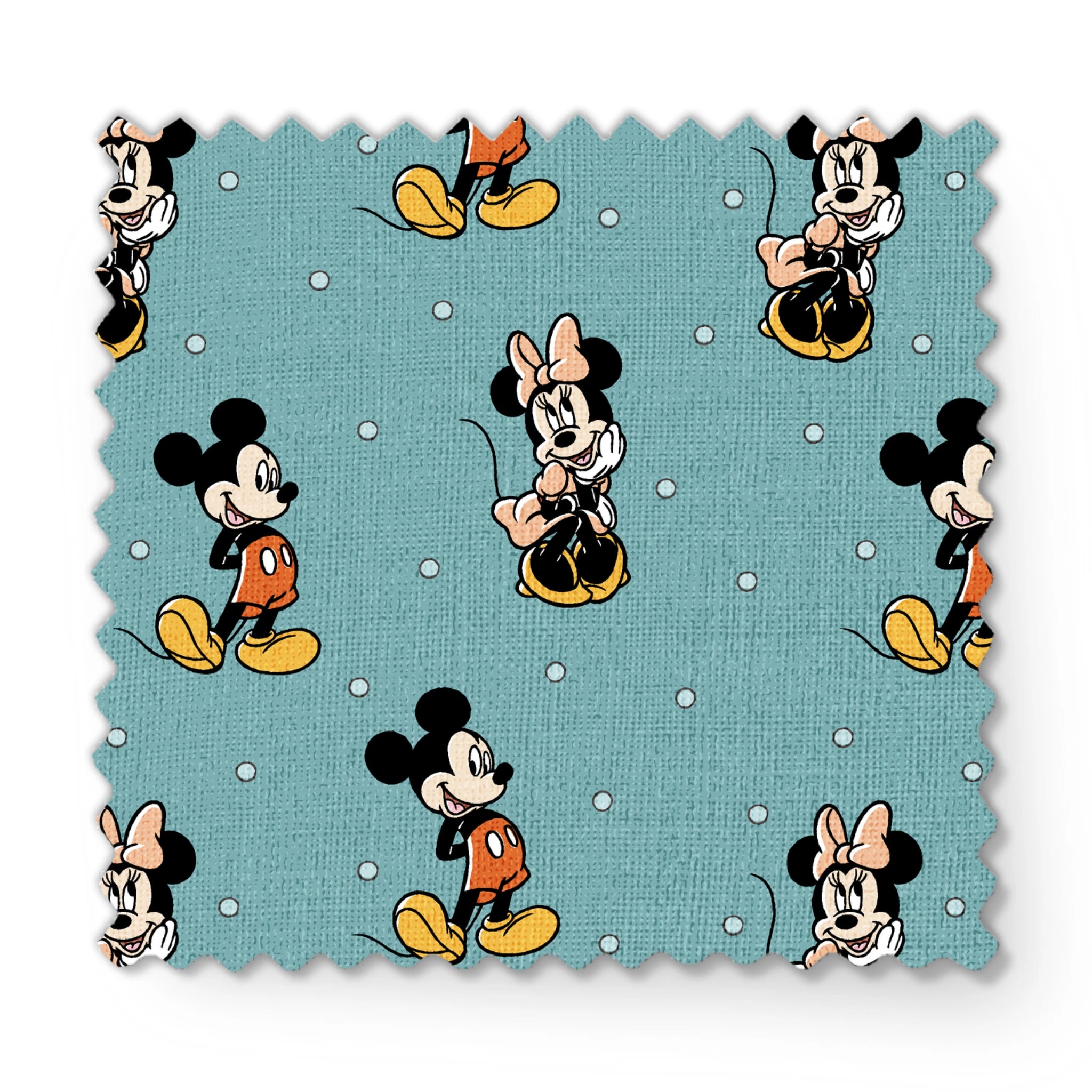 Cartoon pattern of Mickey and Minnie Mouse characters on light blue background with white dots fabric swatch mockup