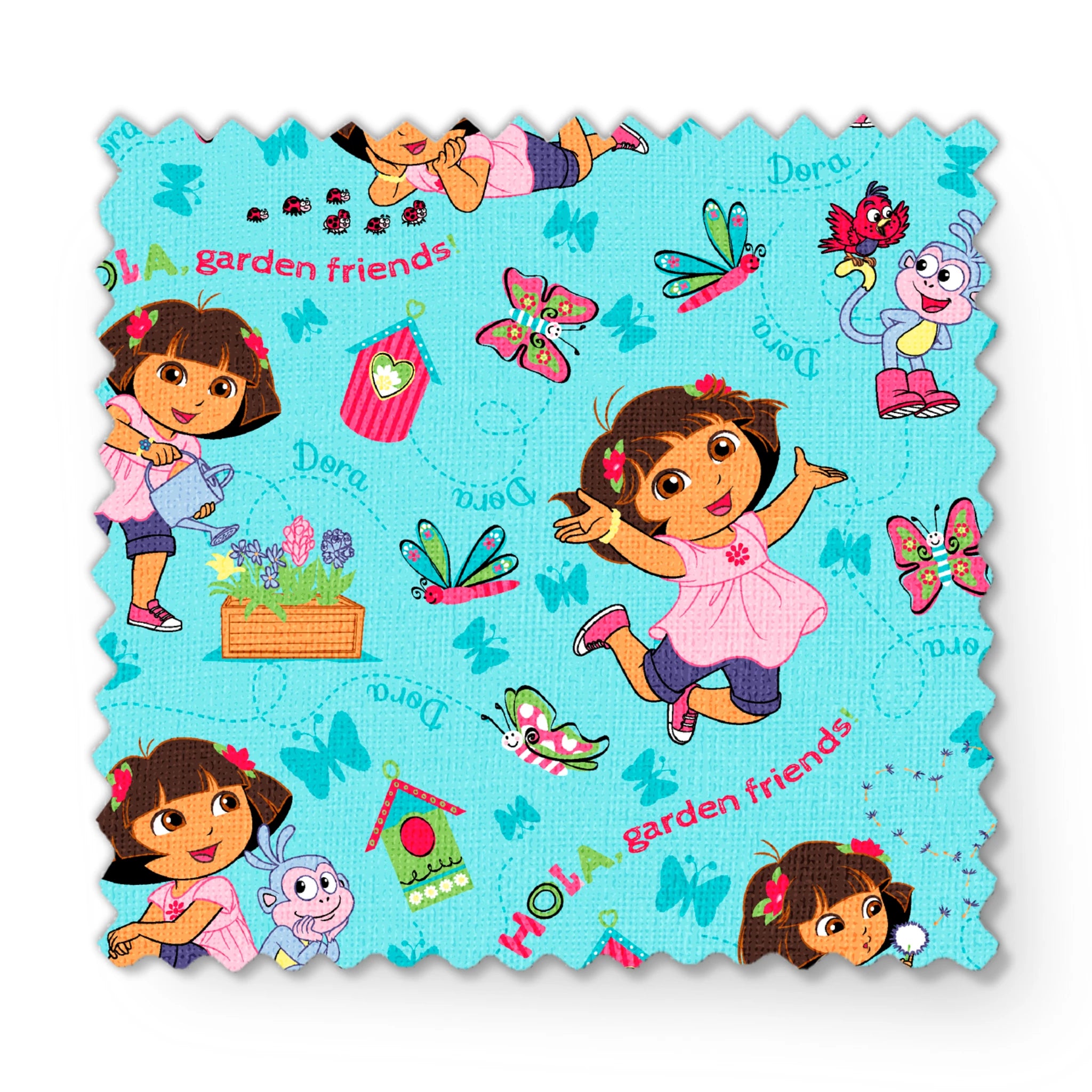 Colorful Dora the Explorer pattern on light blue background fabric swatch mockup