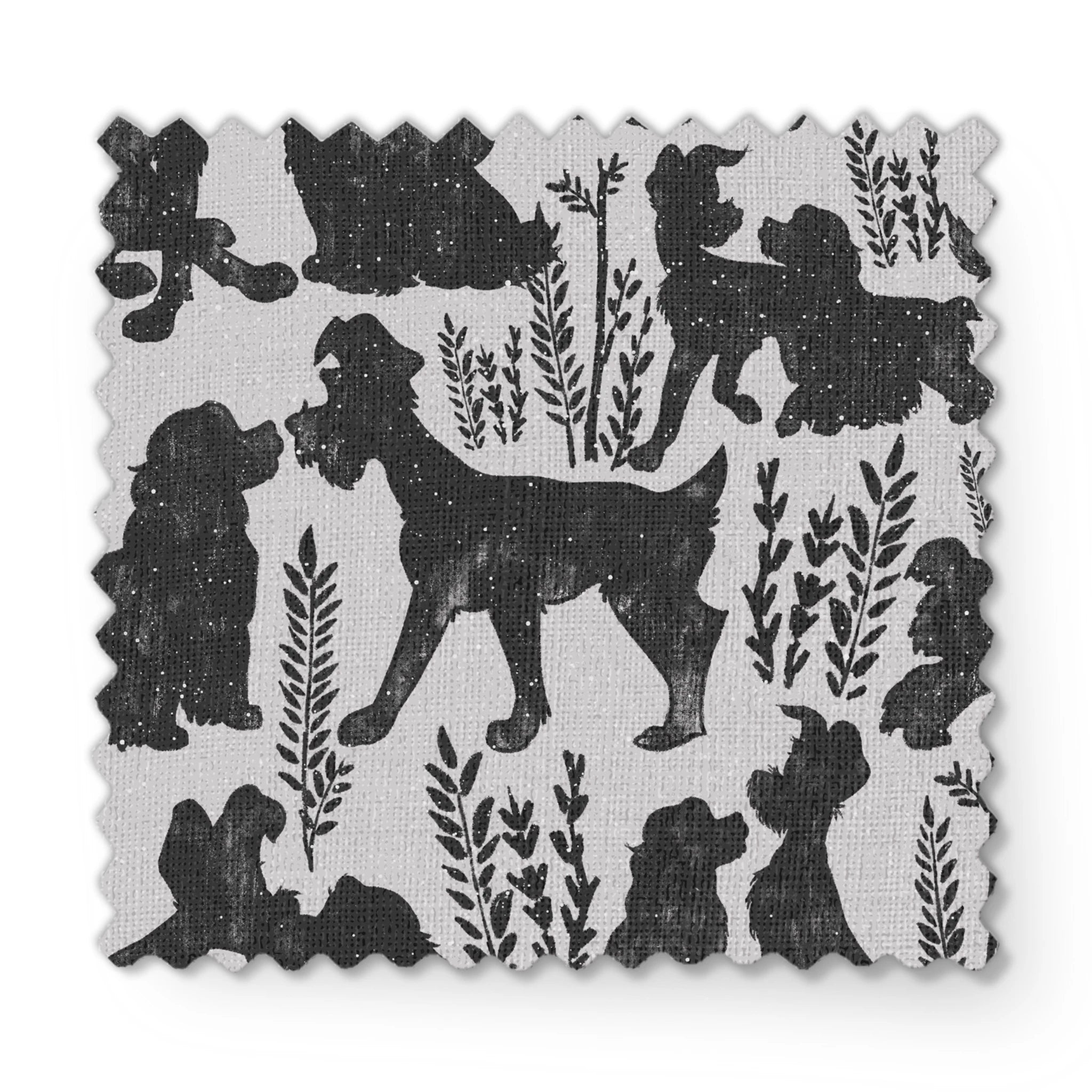 Repeating pattern of black dog silhouettes with decorative plant motifs on a light gray background fabric swatch mockup
