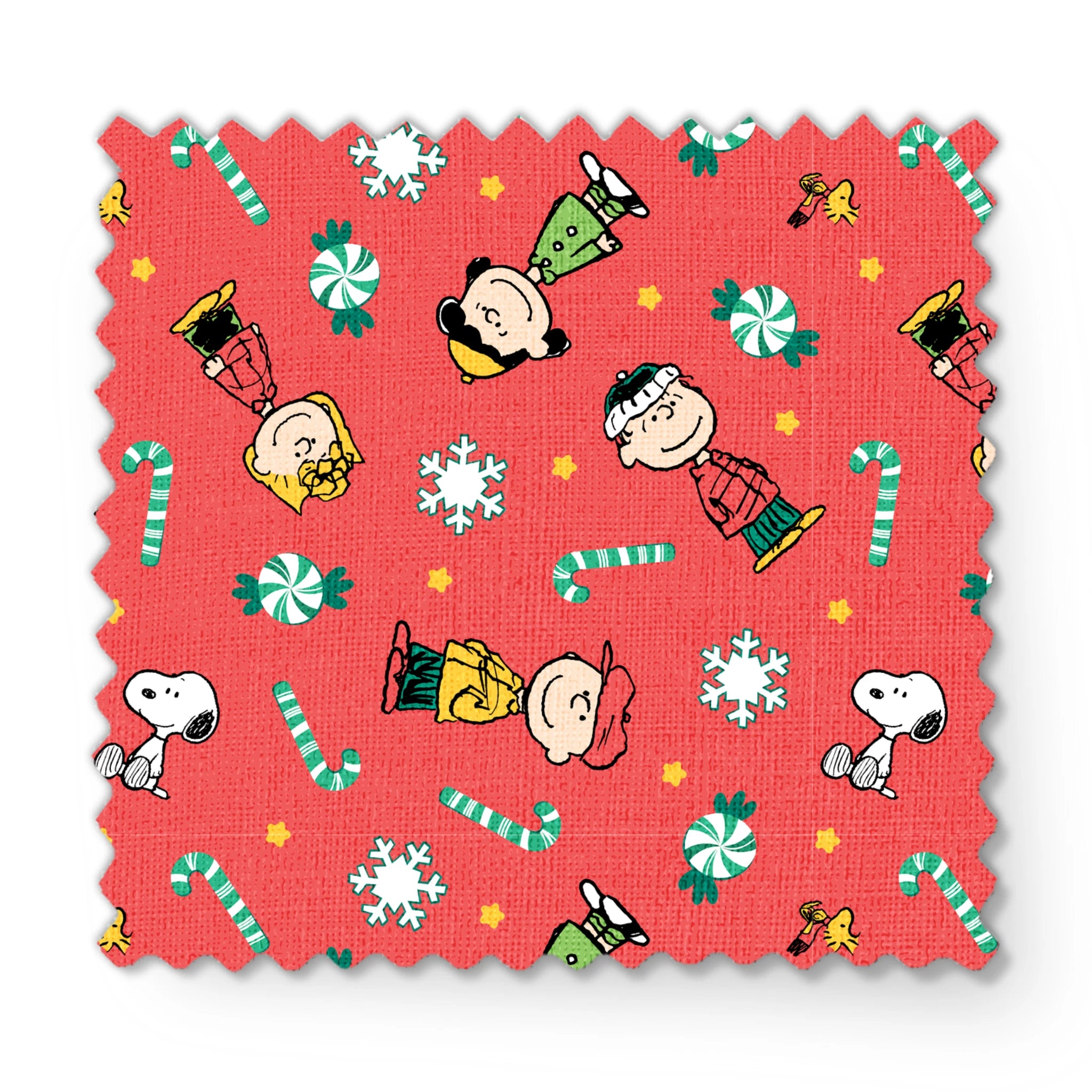 Festive Peanuts cartoon pattern with Charlie Brown characters, candy canes, snowflakes, and peppermints on red background fabric swatch mockup