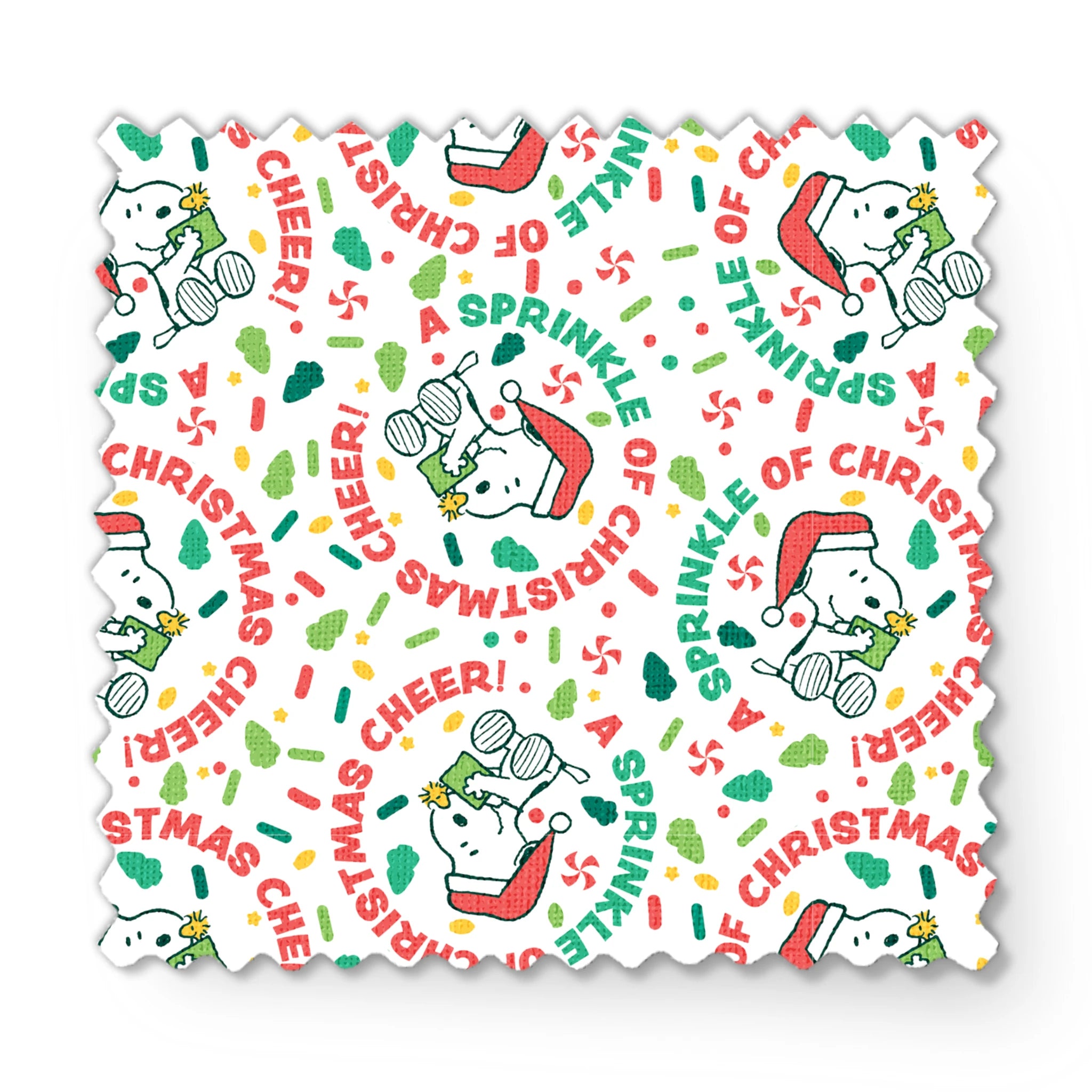 Holiday pattern with Snoopy wearing Santa hat, surrounded by "Merry Christmas", "Cheer", and candy designs on white background fabric swatch mockup