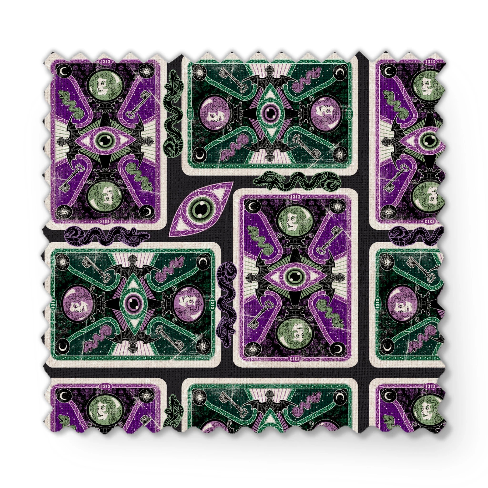 Ornate playing card designs with purple and green patterns featuring central eye motifs and circular number elements against a black background. fabric swatch mockup