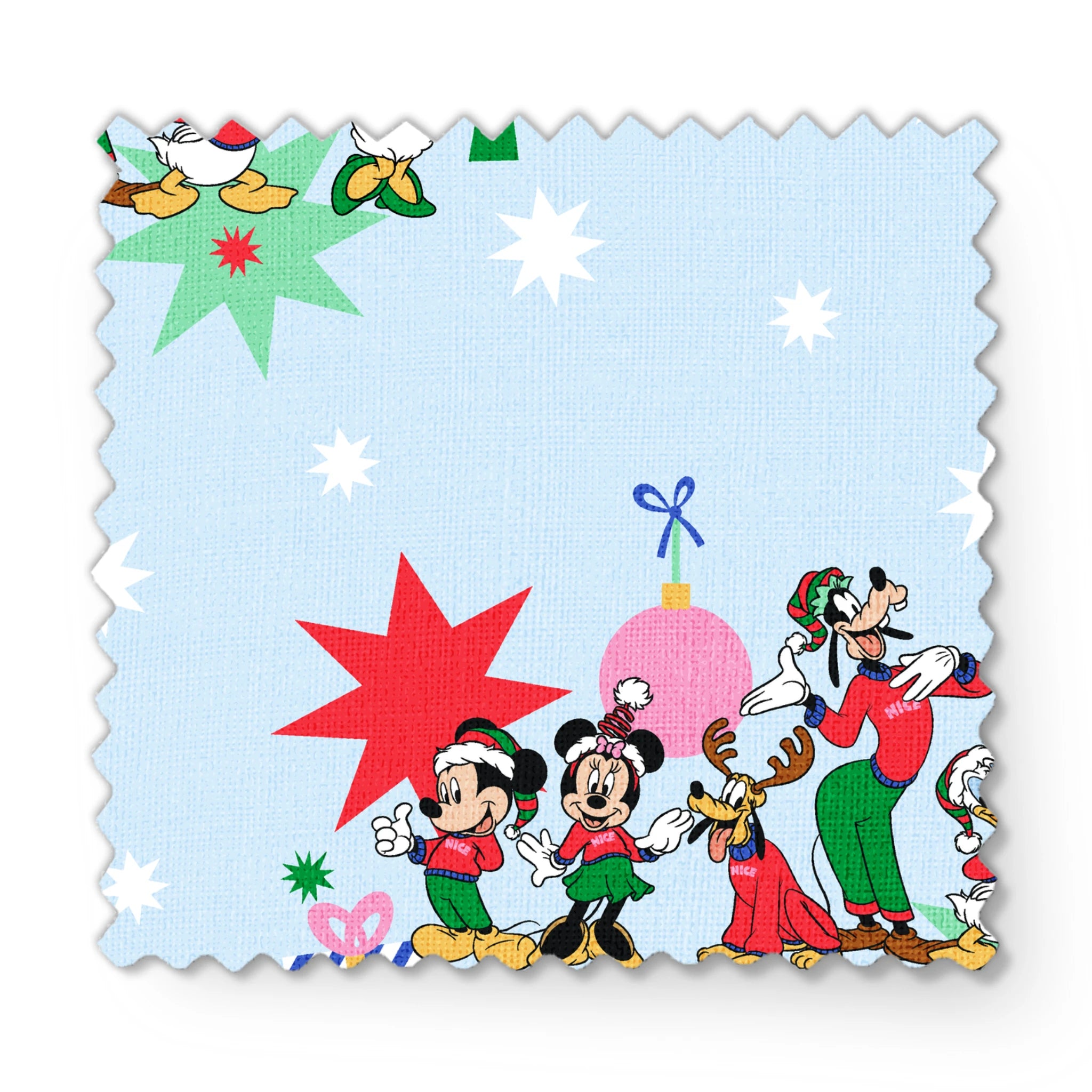 Cartoon Disney characters in festive poses with Christmas trees, ornaments, and stars on light blue snowy background fabric swatch mockup