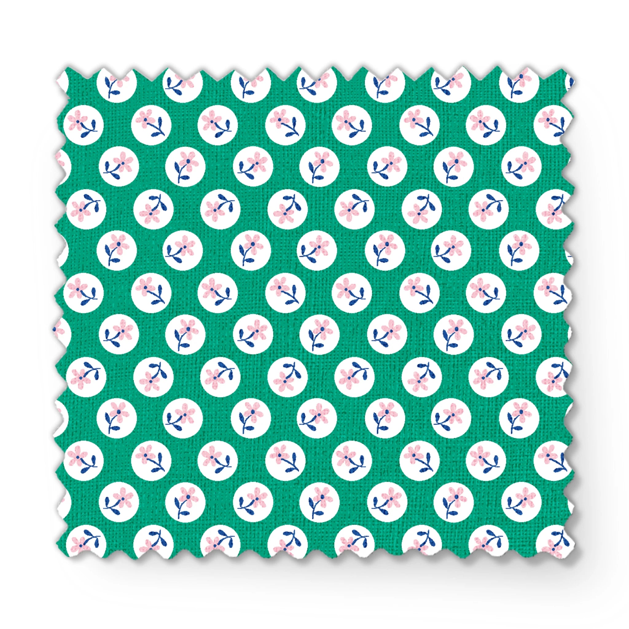 Pink flower motifs with blue stems on white circles against a green background fabric swatch mockup