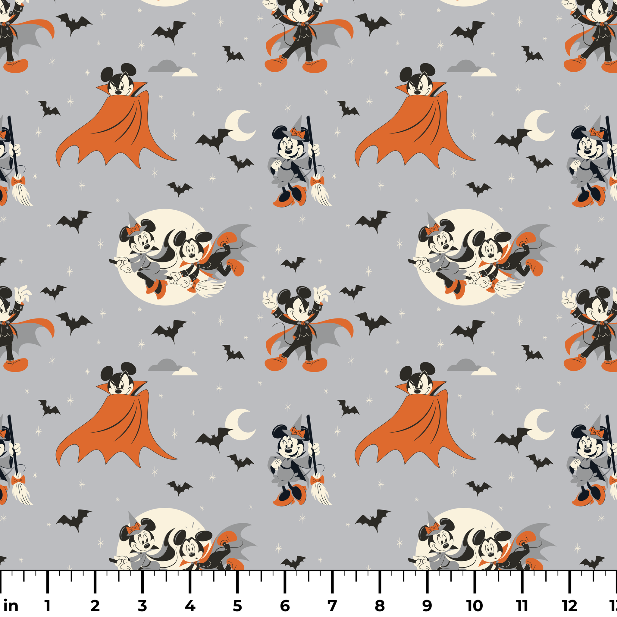 Mickey and Minnie Mouse in Halloween costumes on gray background with bats and moons, orange capes and spooky theme. ruler