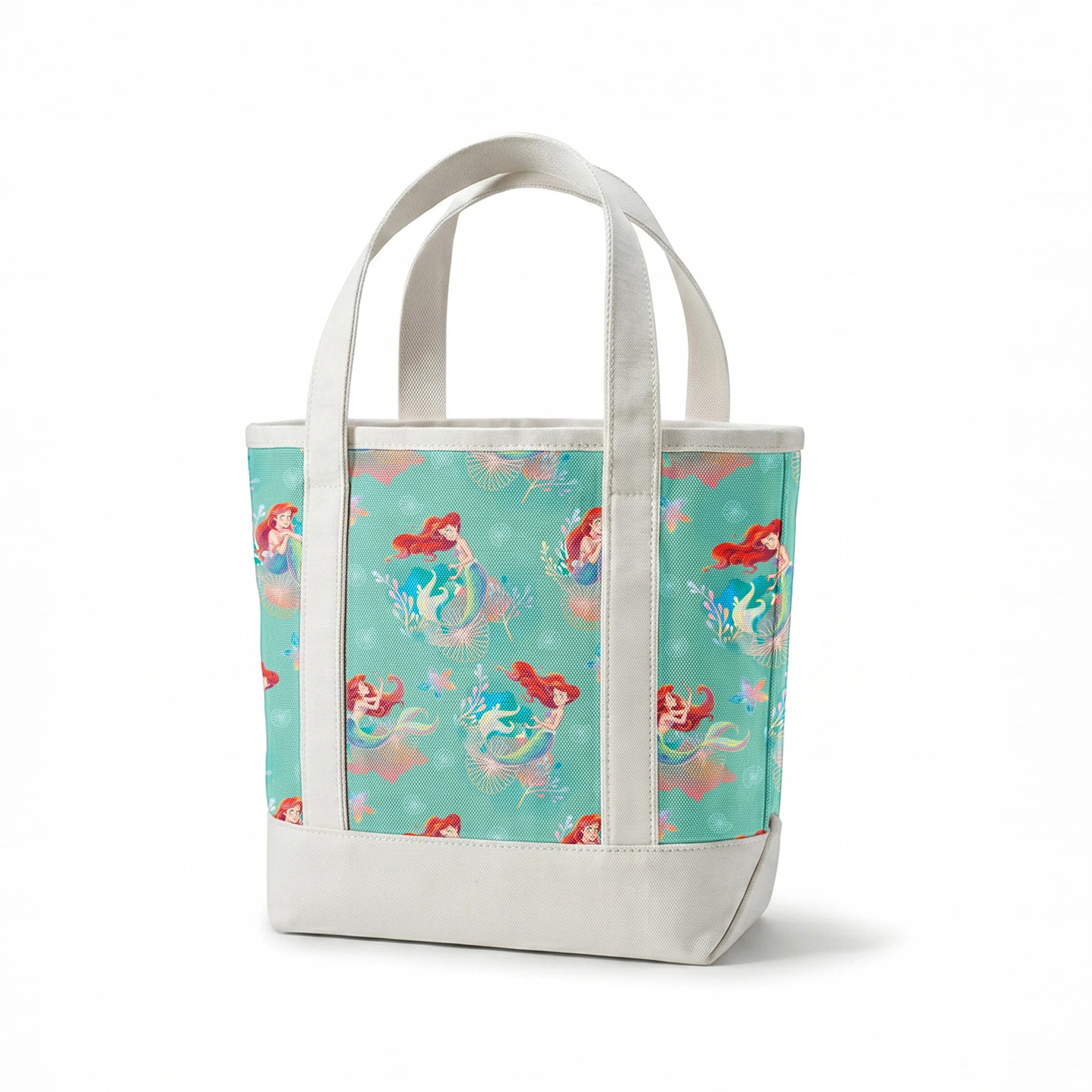 Whimsical teal pattern featuring mermaids with red hair, seashells, starfish, and coral in pastel colors springs canvastote mockup