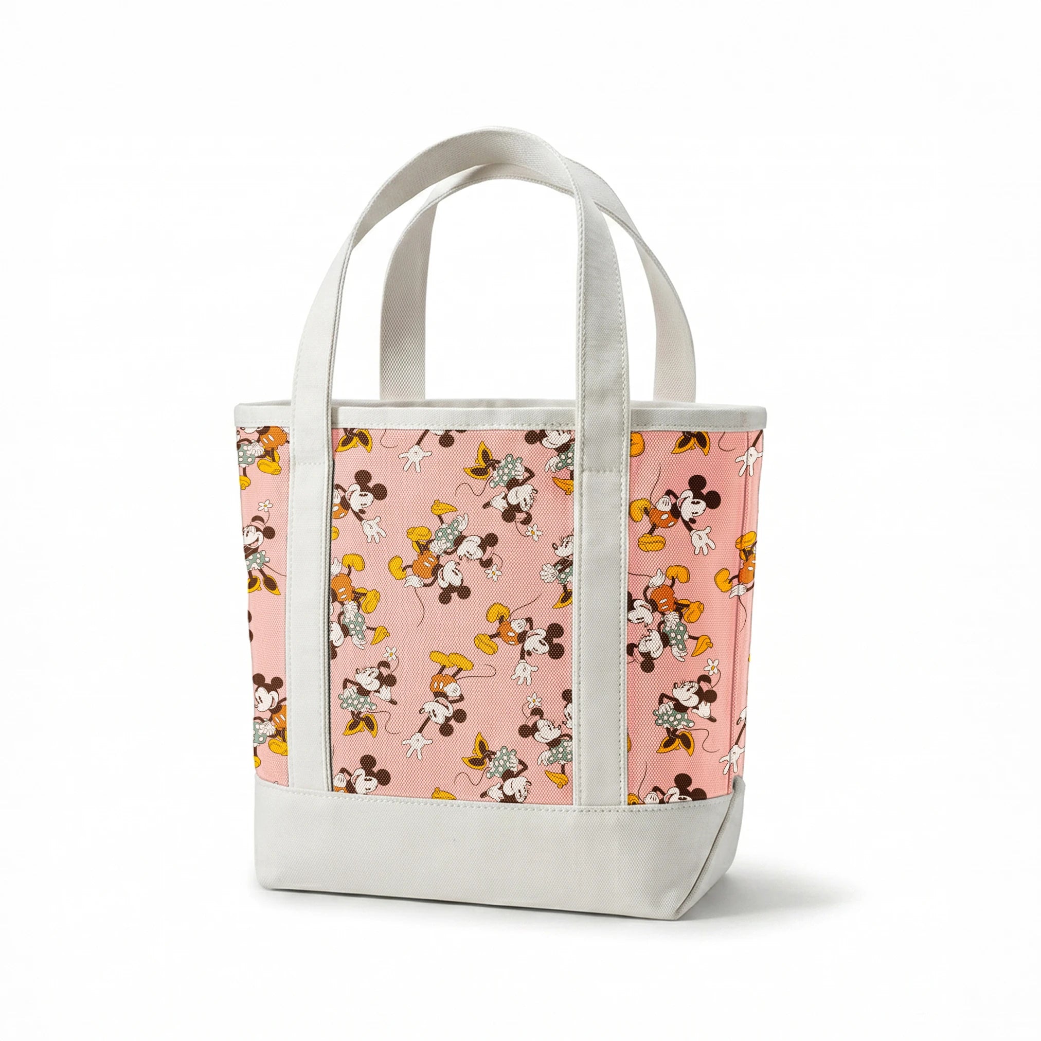 Mickey and Minnie Mouse characters in vintage style on pink background with repeated pattern springs canvastote mockup