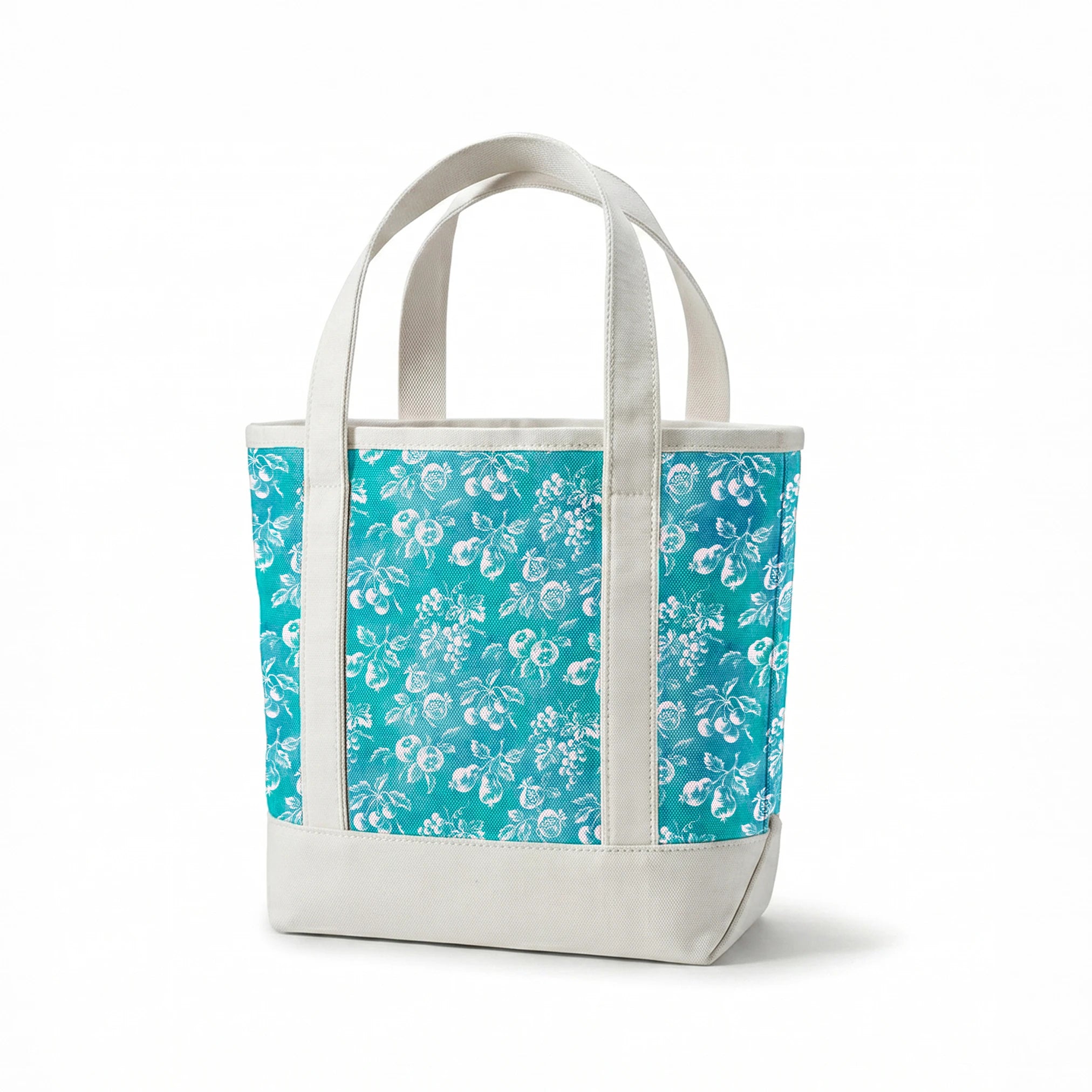 Teal background with white vintage fruit pattern featuring cherries, grapes, and pears springs canvastote mockup