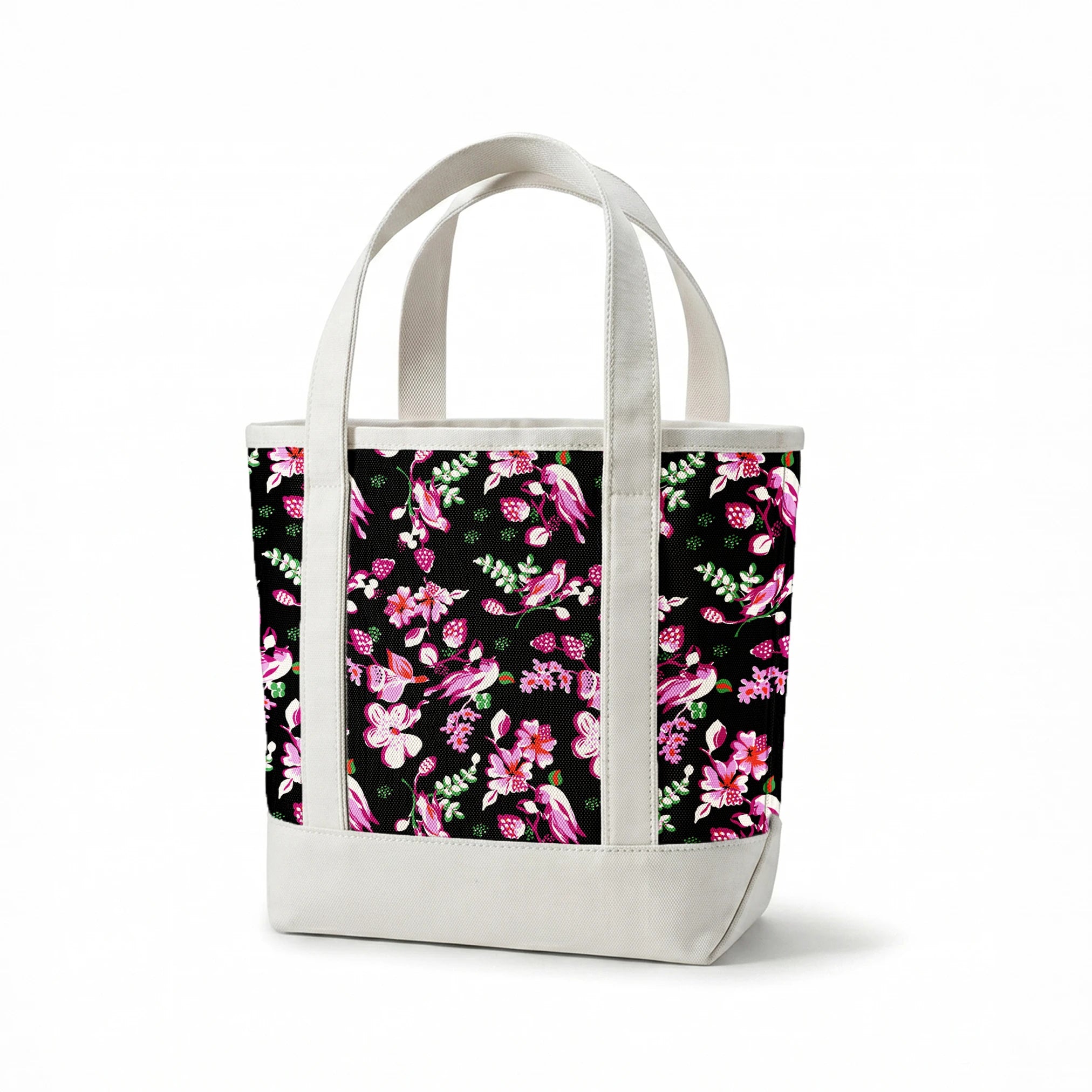 Vibrant pink birds and flowers pattern on black background with strawberry accents springs canvastote mockup