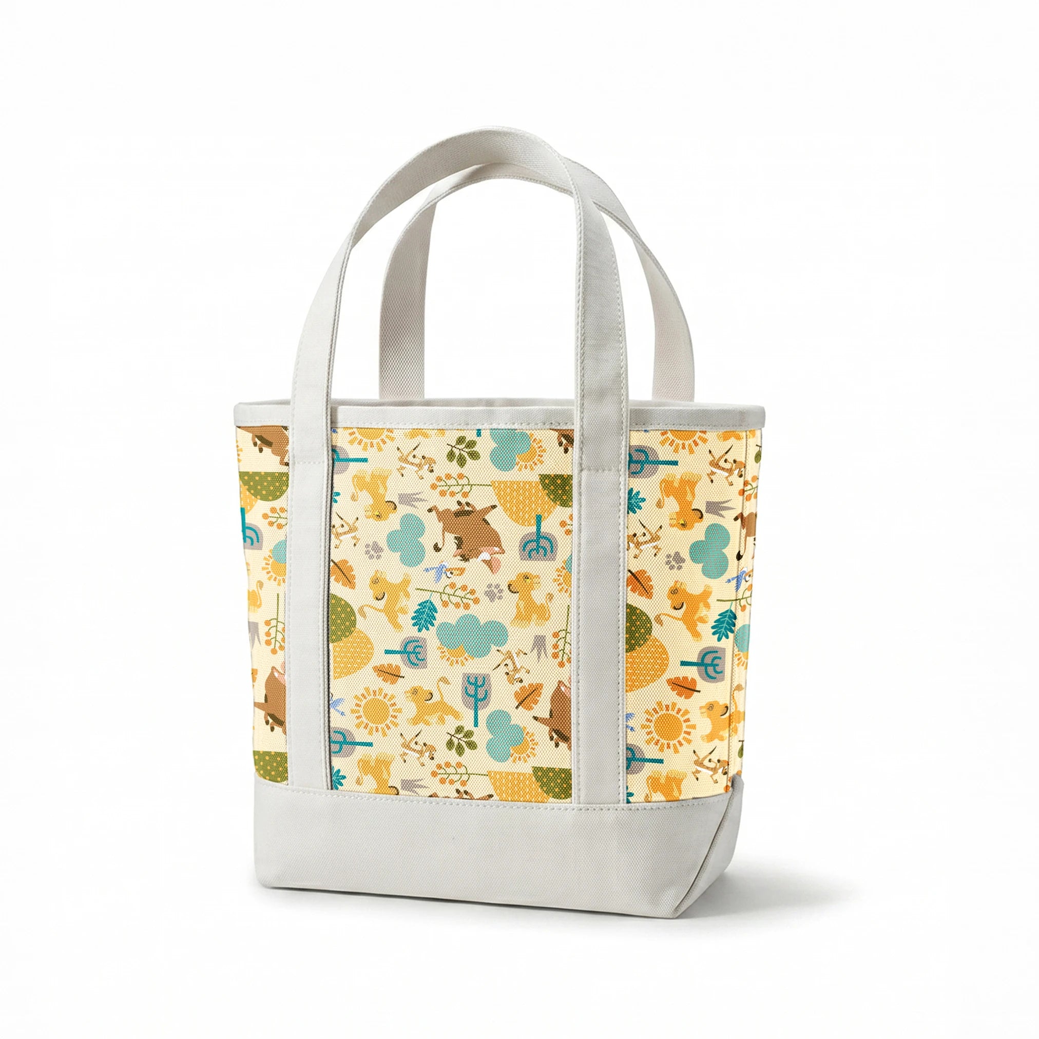 Playful Lion King pattern with brown bears, yellow puppies, blue clouds, stylized trees, and sun motifs on cream background springs canvastote mockup