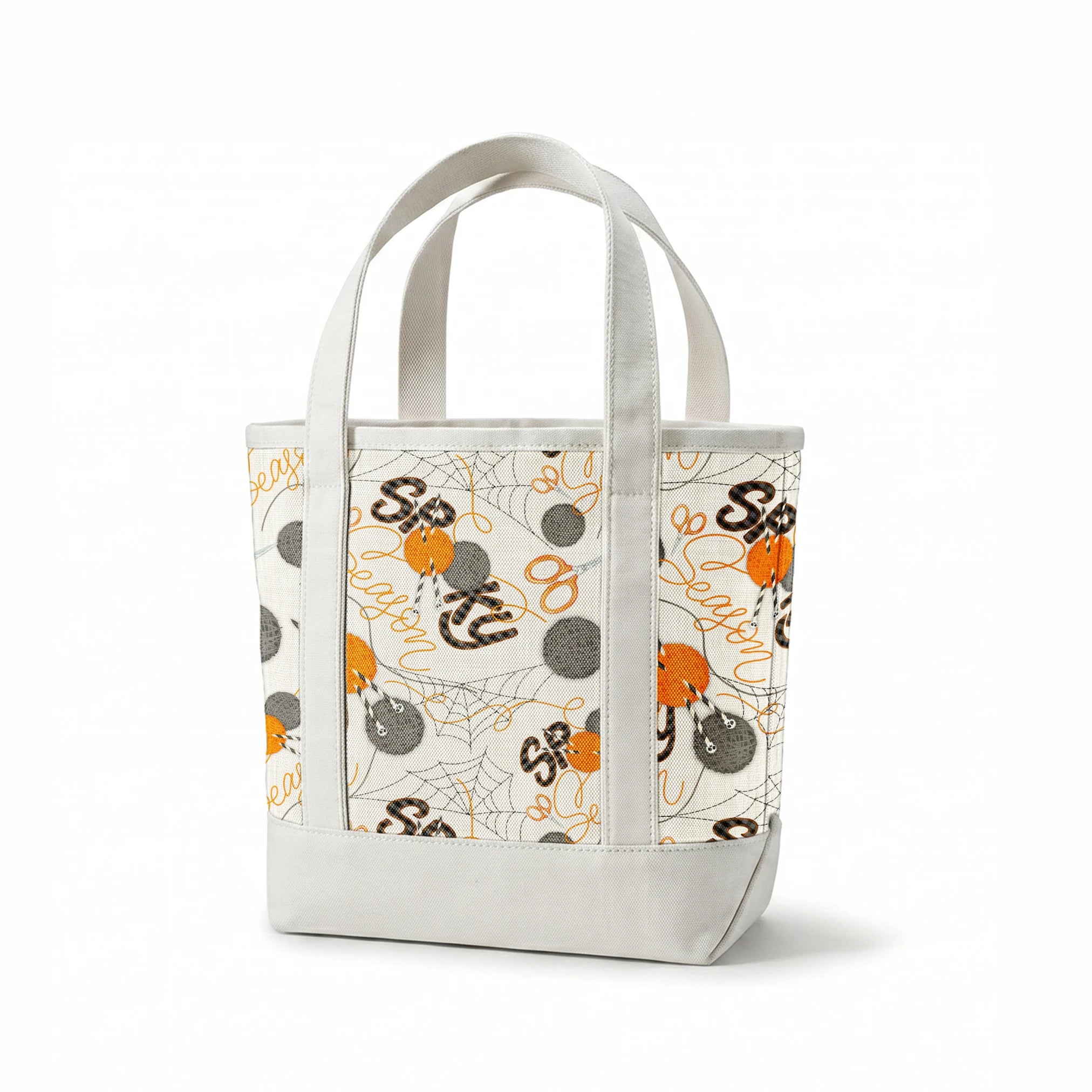 Halloween design by Nicole Tamarin featuring orange and gray yarn balls, scissors, spiderwebs, and “Spooky Season” lettering on a cream background. springs canvastote mockup