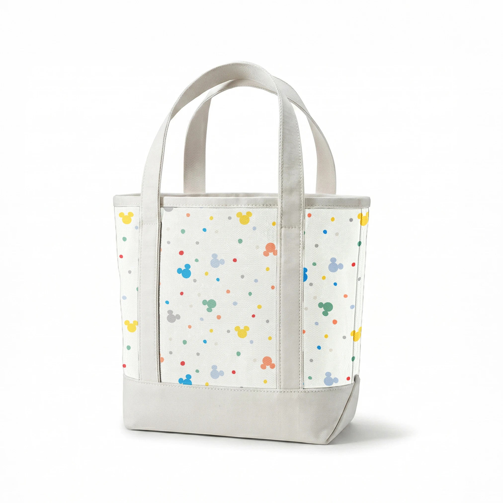 Colorful Disney Mickey Mouse silhouette pattern with pastel dots on white background springs canvastote mockup