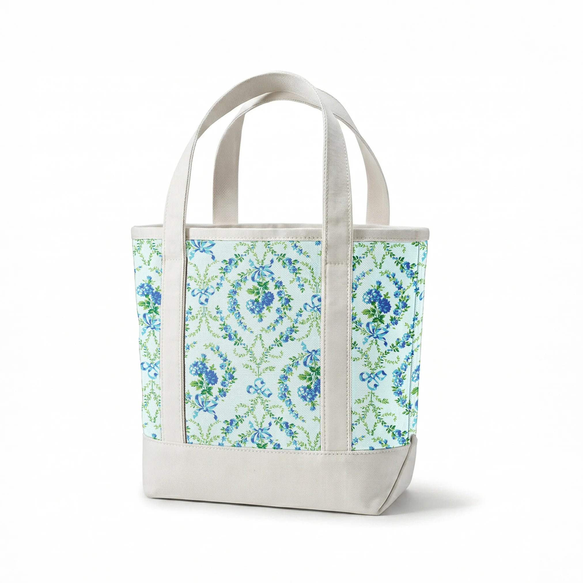 Blue floral pattern with diamond lattice design featuring delicate ribbons and green foliage on light background springs canvastote mockup