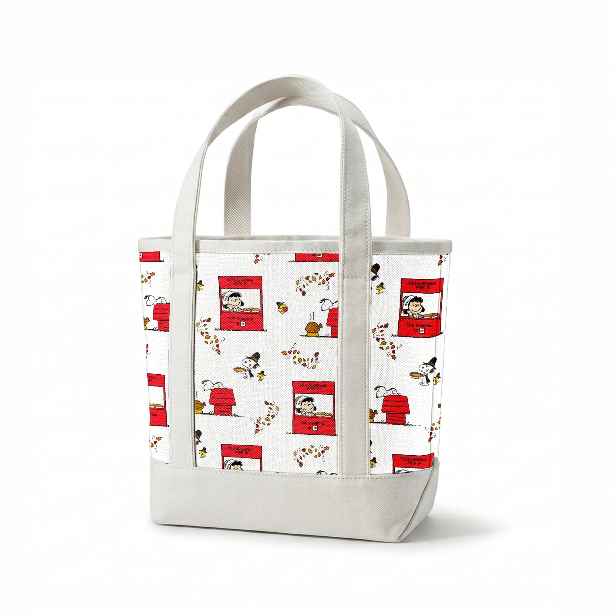 Peanuts Thanksgiving pattern with Snoopy, red booths, doghouses, and falling autumn leaves on white background springs canvastote mockup