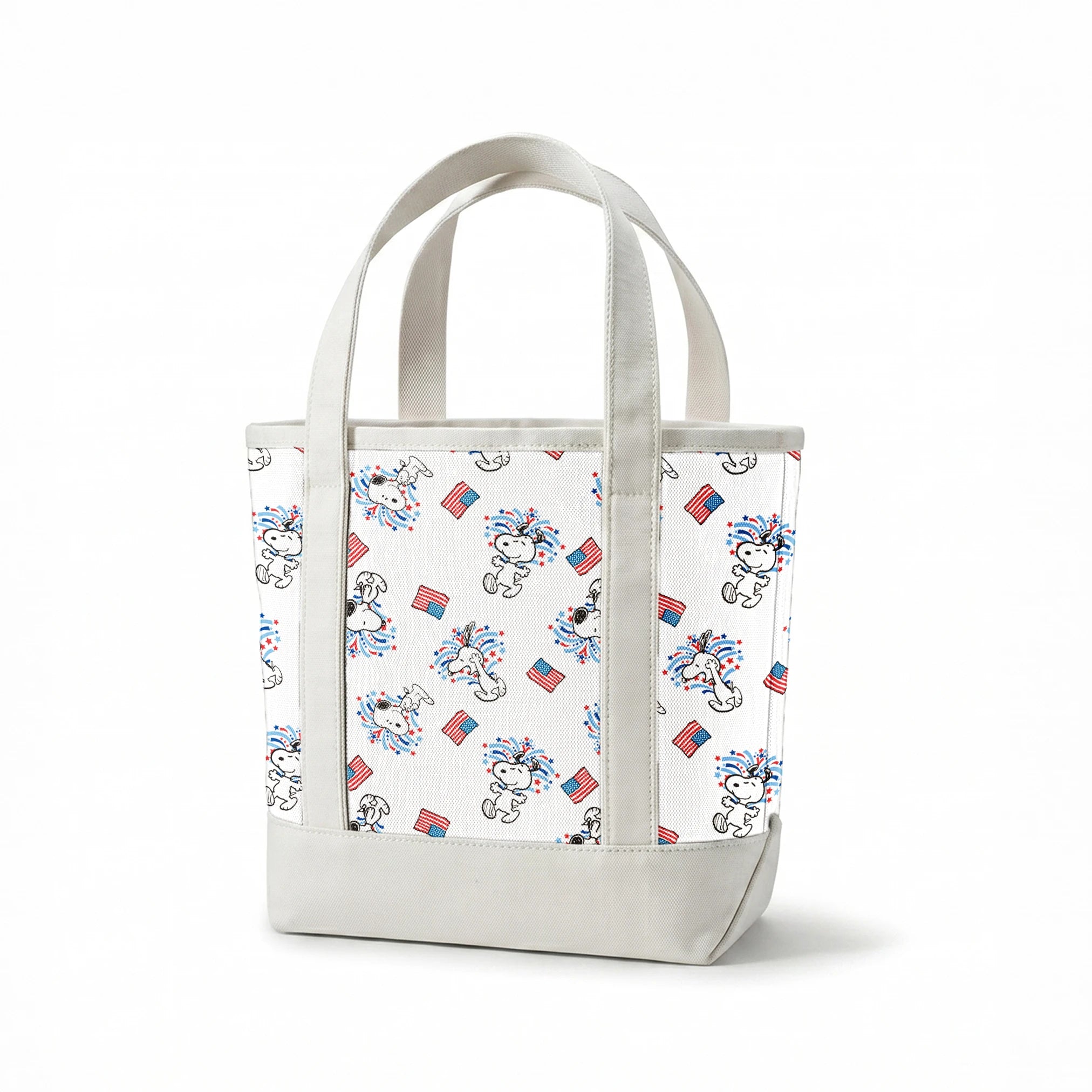 Snoopy with red and blue fireworks pattern alongside American flags on white background springs canvastote mockup